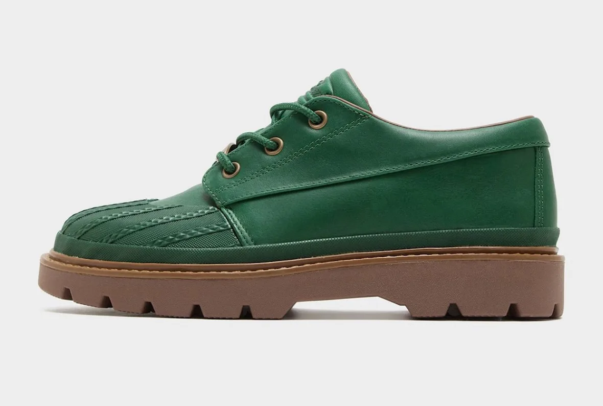 Lateral view of green leather shoe, ribbed toe cap, brass eyelets, brown lugged sole, Bronco Boot Low