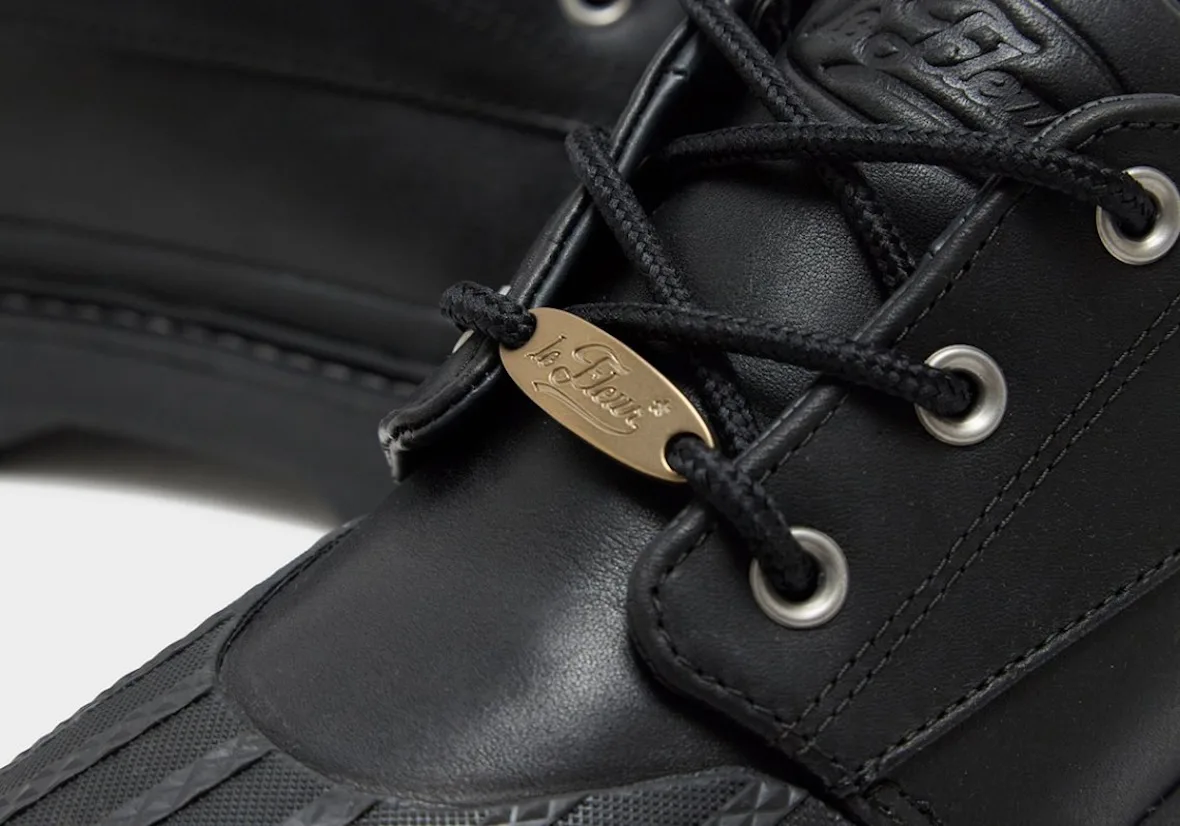 Detail of black laces, gold oval lace tag with script text and silver eyelets, Bronco Boot Low