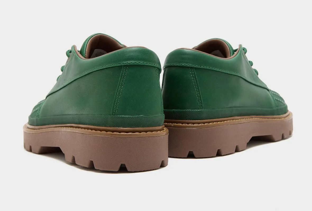 Heel view of green leather pair with brown lining and stitched heel, gum soles, Bronco Boot Low