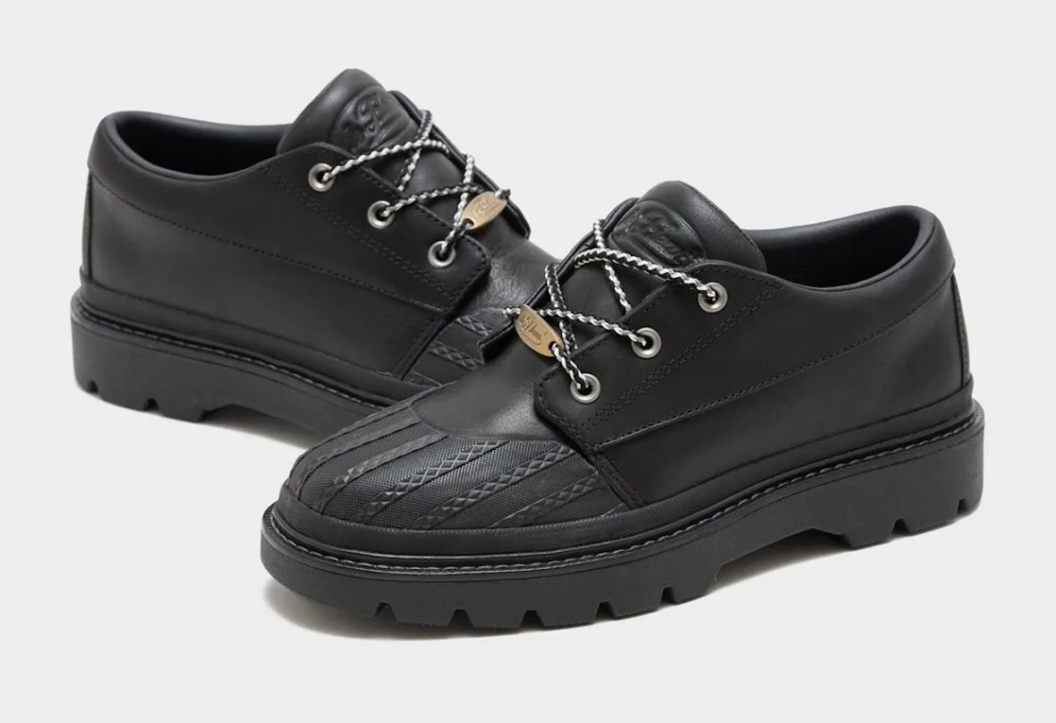 Black pair with black and white laces, ribbed toe cap and gold oval lace tag, Bronco Boot Low