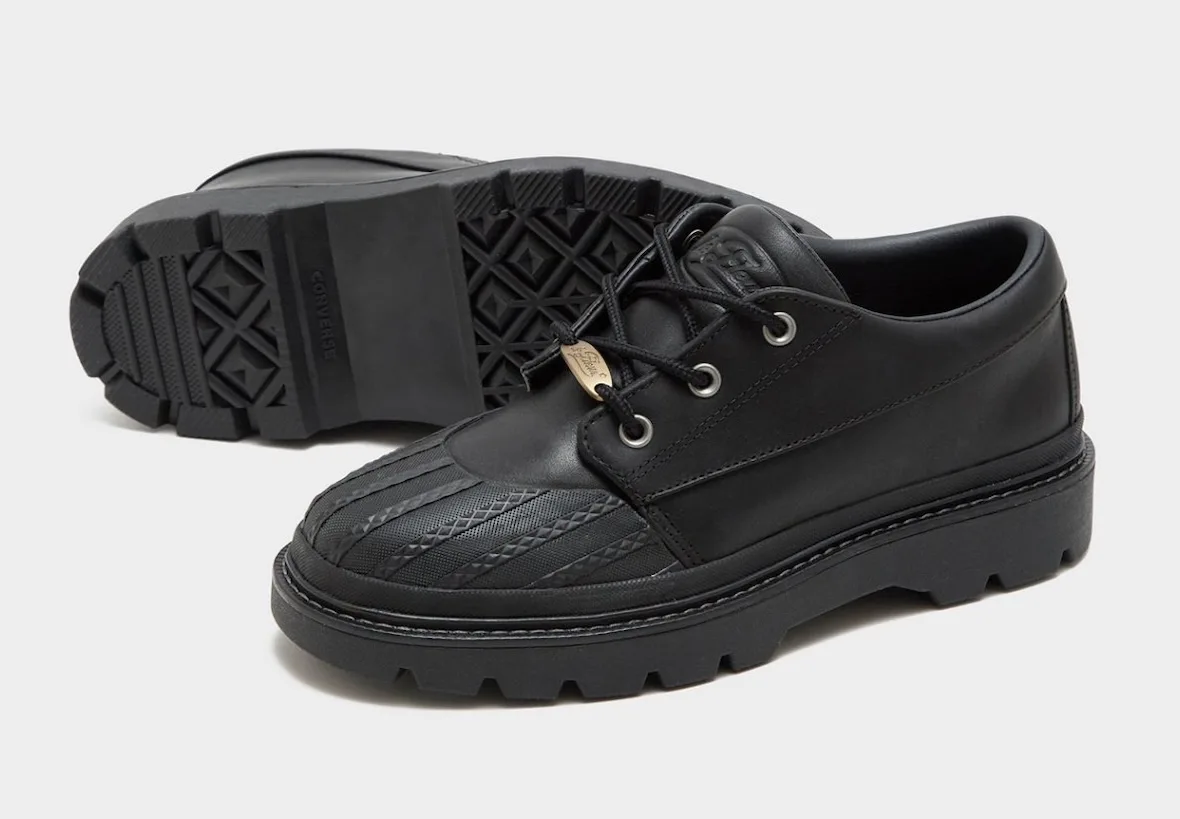 Black pair with one shoe showing diamond-pattern outsole and Converse text, Bronco Boot Low