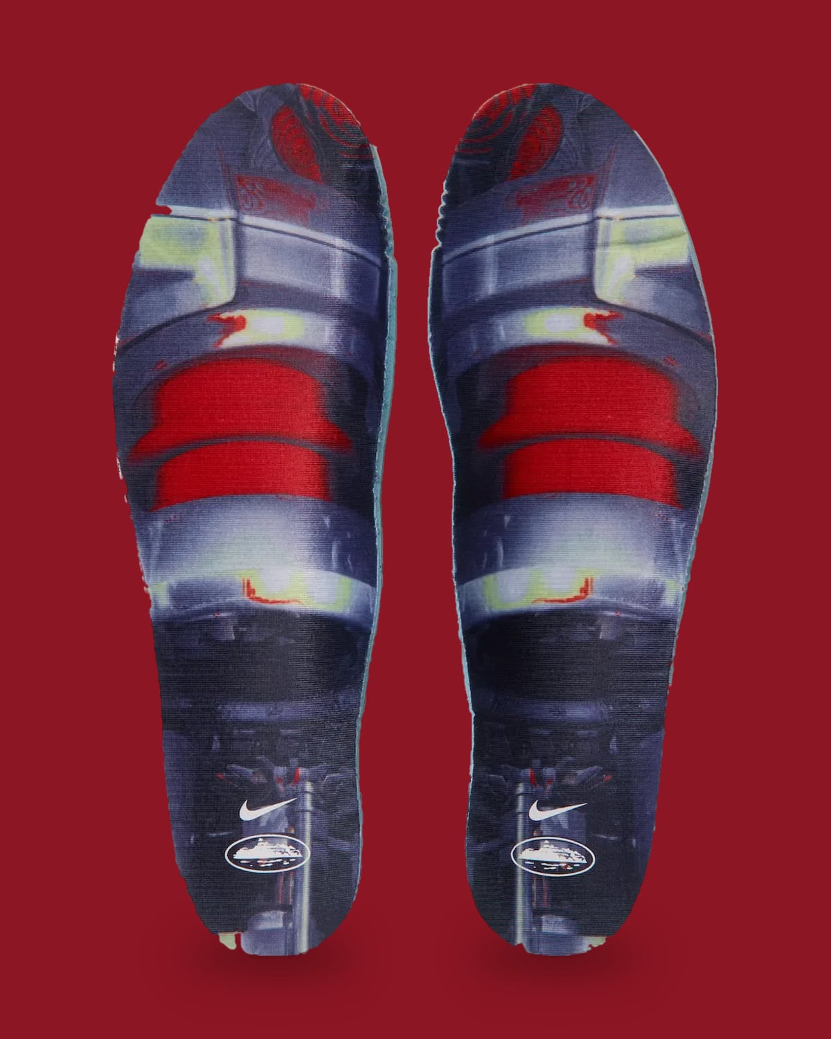 Top-down view of pair of insoles: grey, red and green graphic print with Nike swoosh and logo, Game Royal
