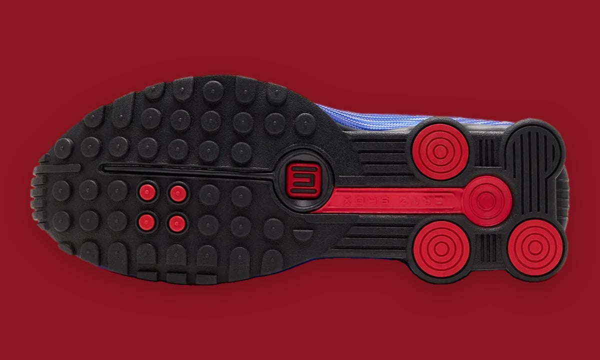 Outsole view: black studded sole with red circular heel pods, red logo and CRTZ SHOX text, Game Royal