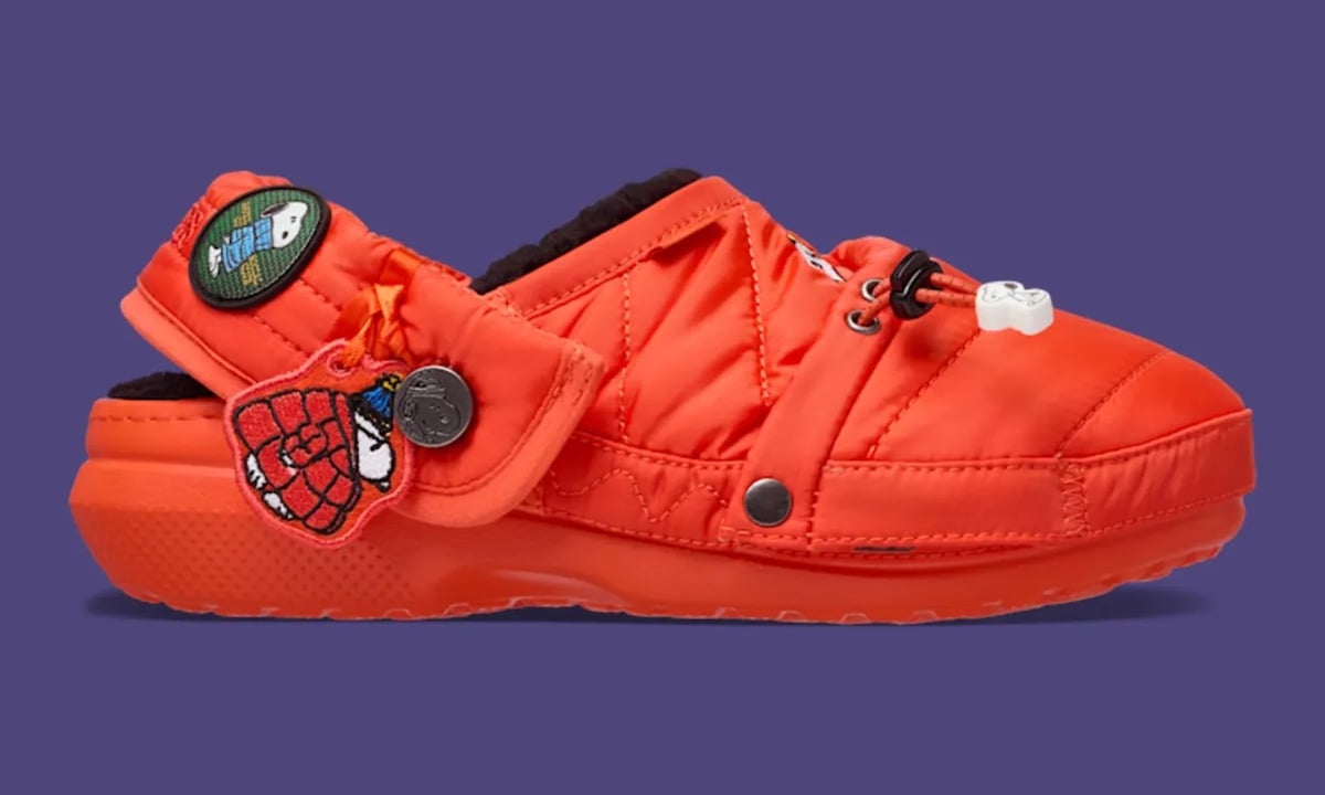 Lateral view of orange quilted clog with black fleece lining and Snoopy patches, Classic Lined Clog