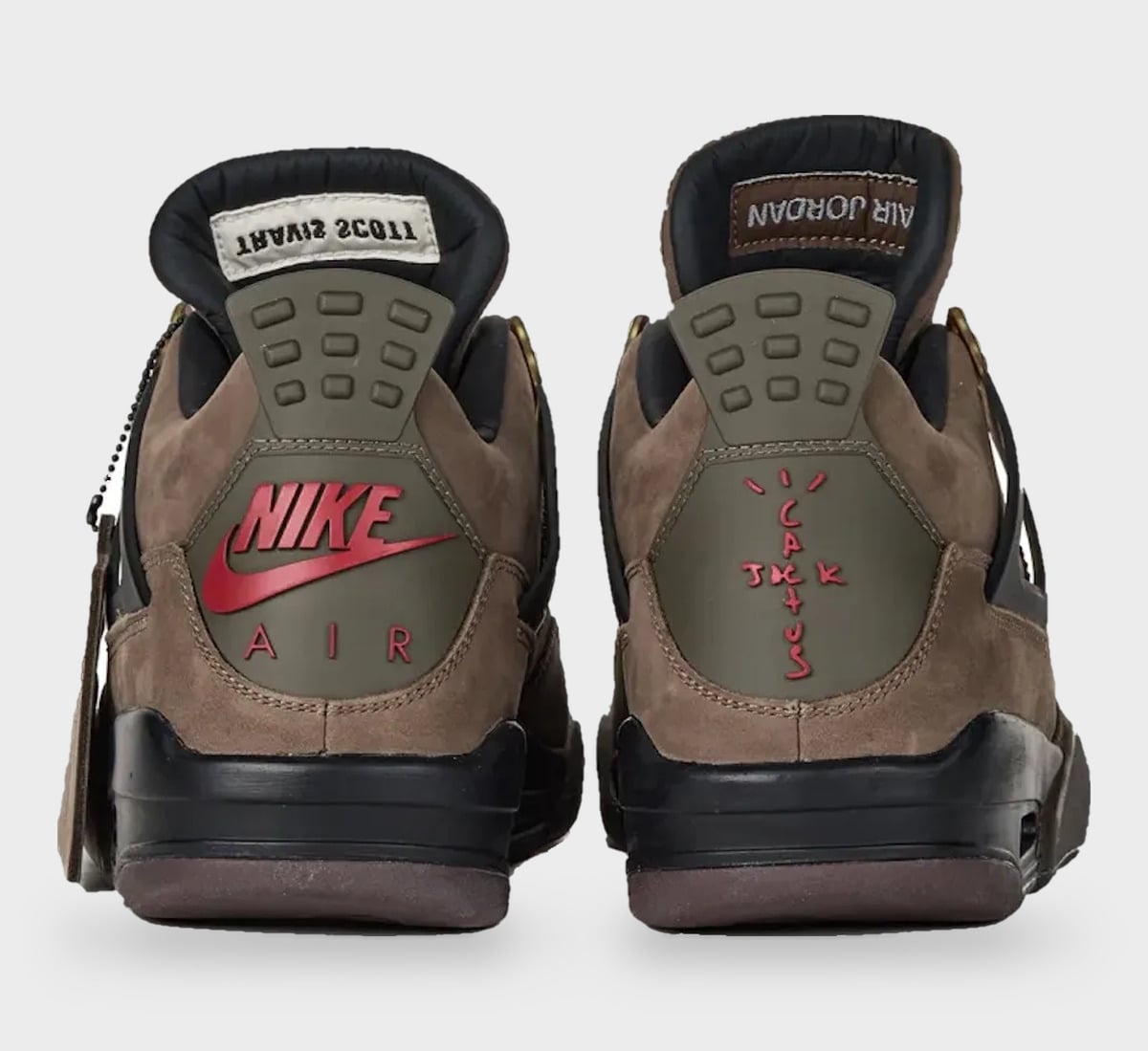 Heel view of pair; brown suede, olive heel tabs, red Nike Air and cactus logo, Travis Scott label, StockX LISTED Collection