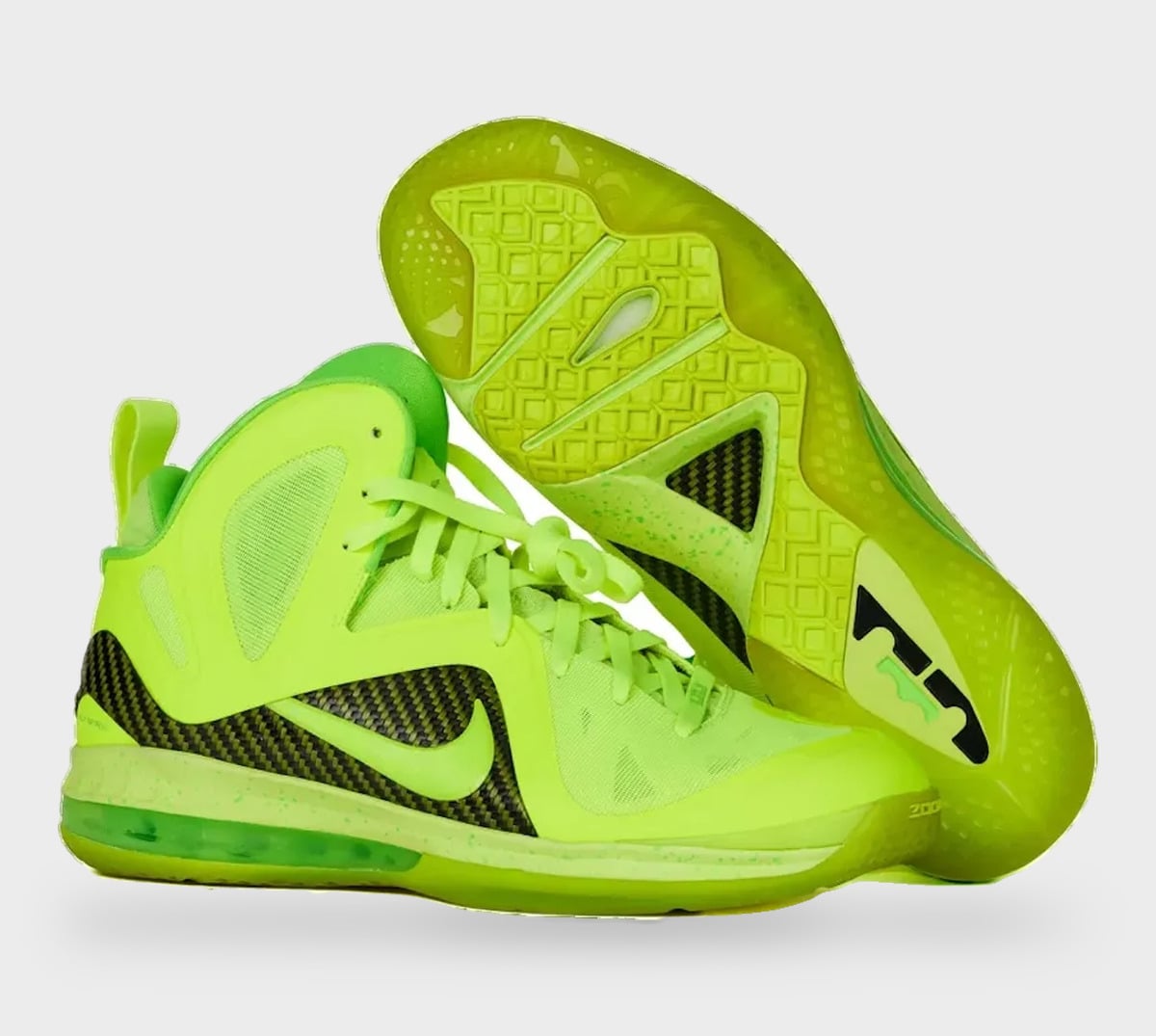 Pair with outsole up; neon green upper, black carbon-fibre-look panels, green translucent sole, StockX LISTED Collection