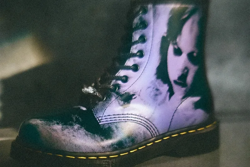 Close side view of boot with halftone purple face print, yellow welt stitching and black laces, The Exorcist