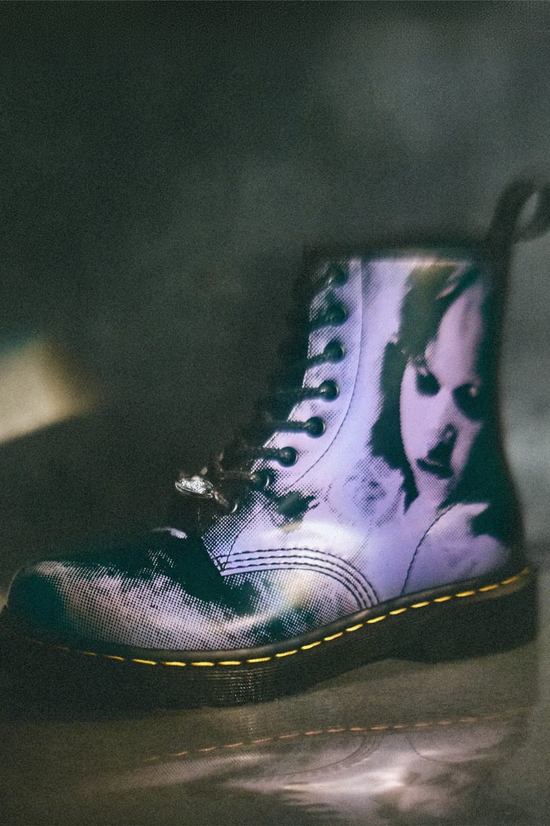 Lateral view of lace-up boot with halftone purple-toned face print and yellow stitching on a dark surface, The Exorcist