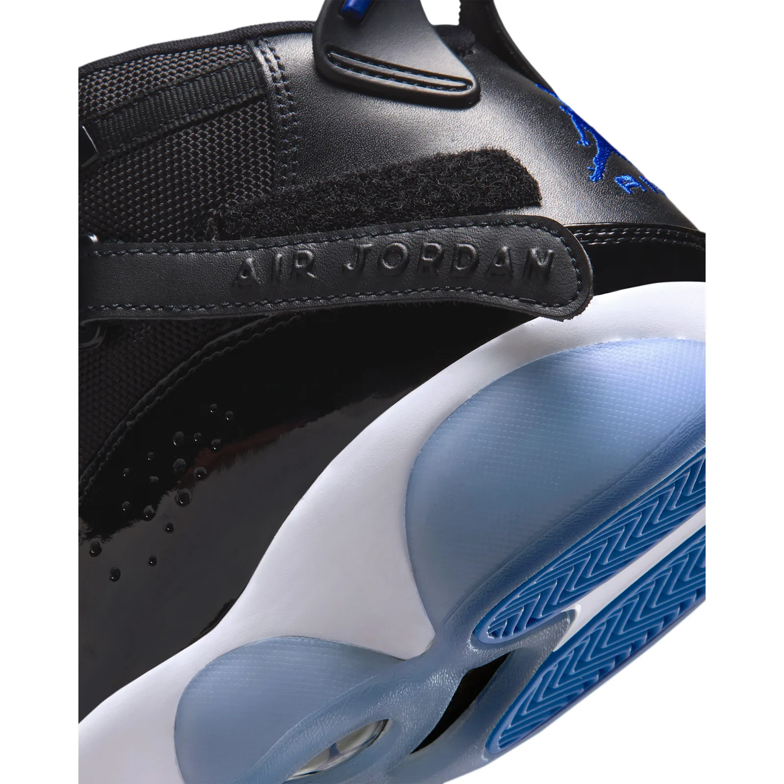 Side detail with an embossed Air Jordan strap and glossy black panel, Space Jam