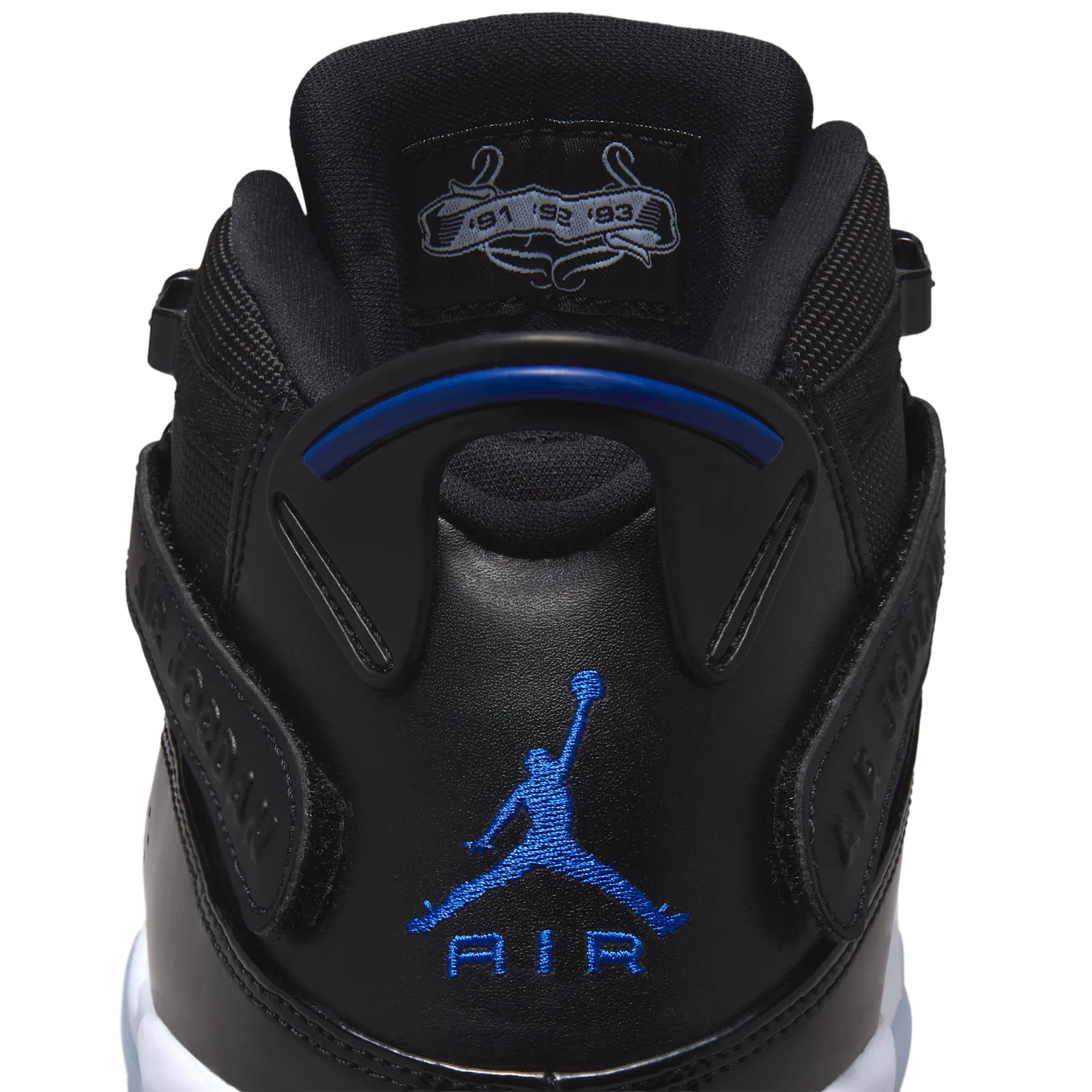 Heel detail with blue Jumpman Air embroidery and a blue-accented pull tab, Space Jam