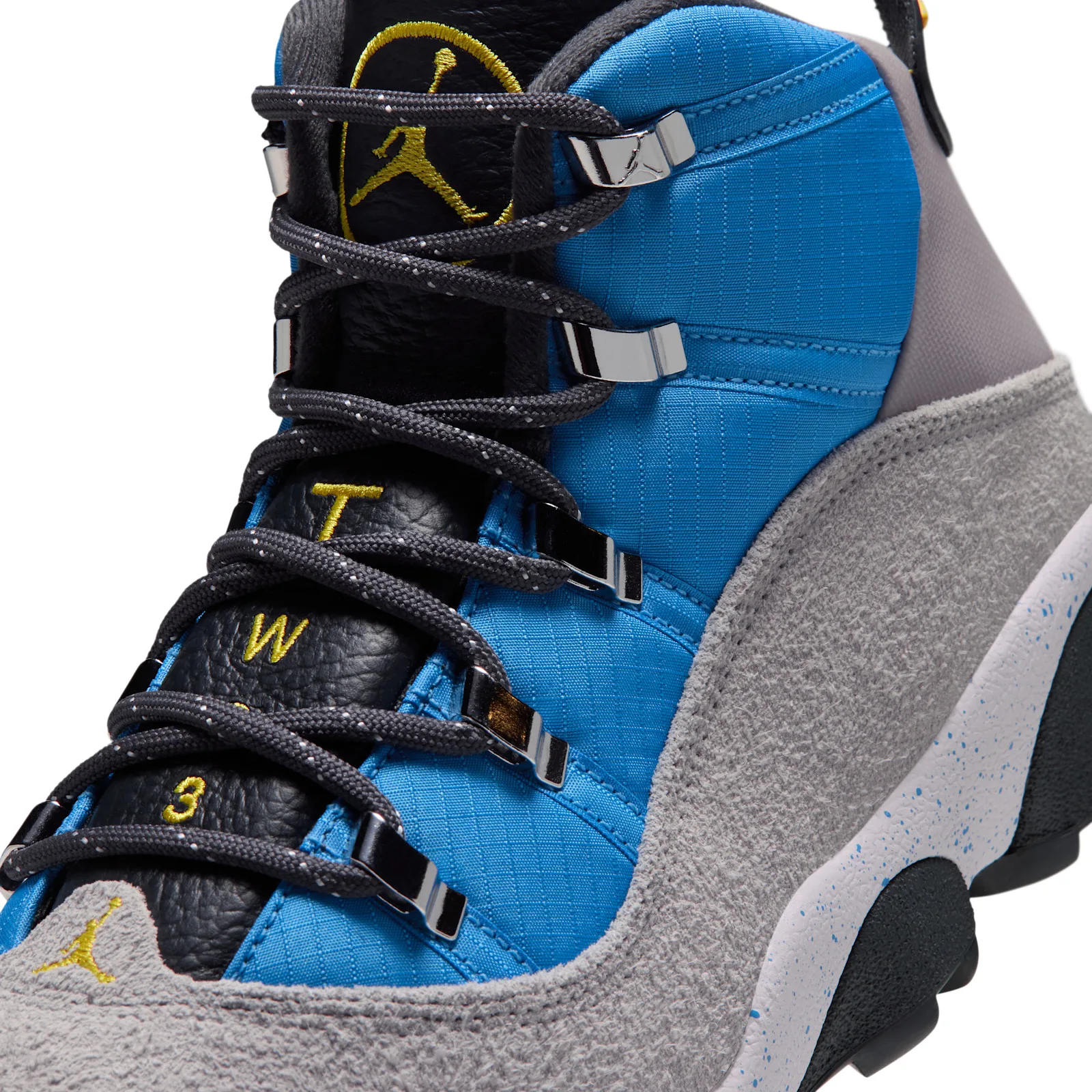 Detail of the lacing with silver hooks, yellow Jumpman tongue logo, T-W-3 text and blue ripstop, Cobalt Blue
