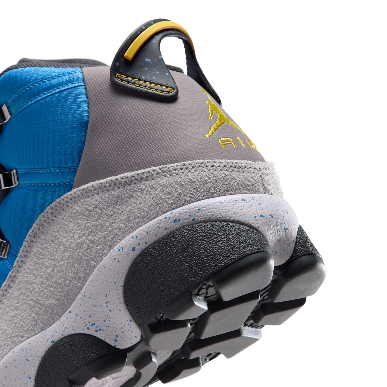 Detail of the heel with yellow Jumpman and AIR logo, yellow pull loop and blue-speckled grey midsole, Cobalt Blue