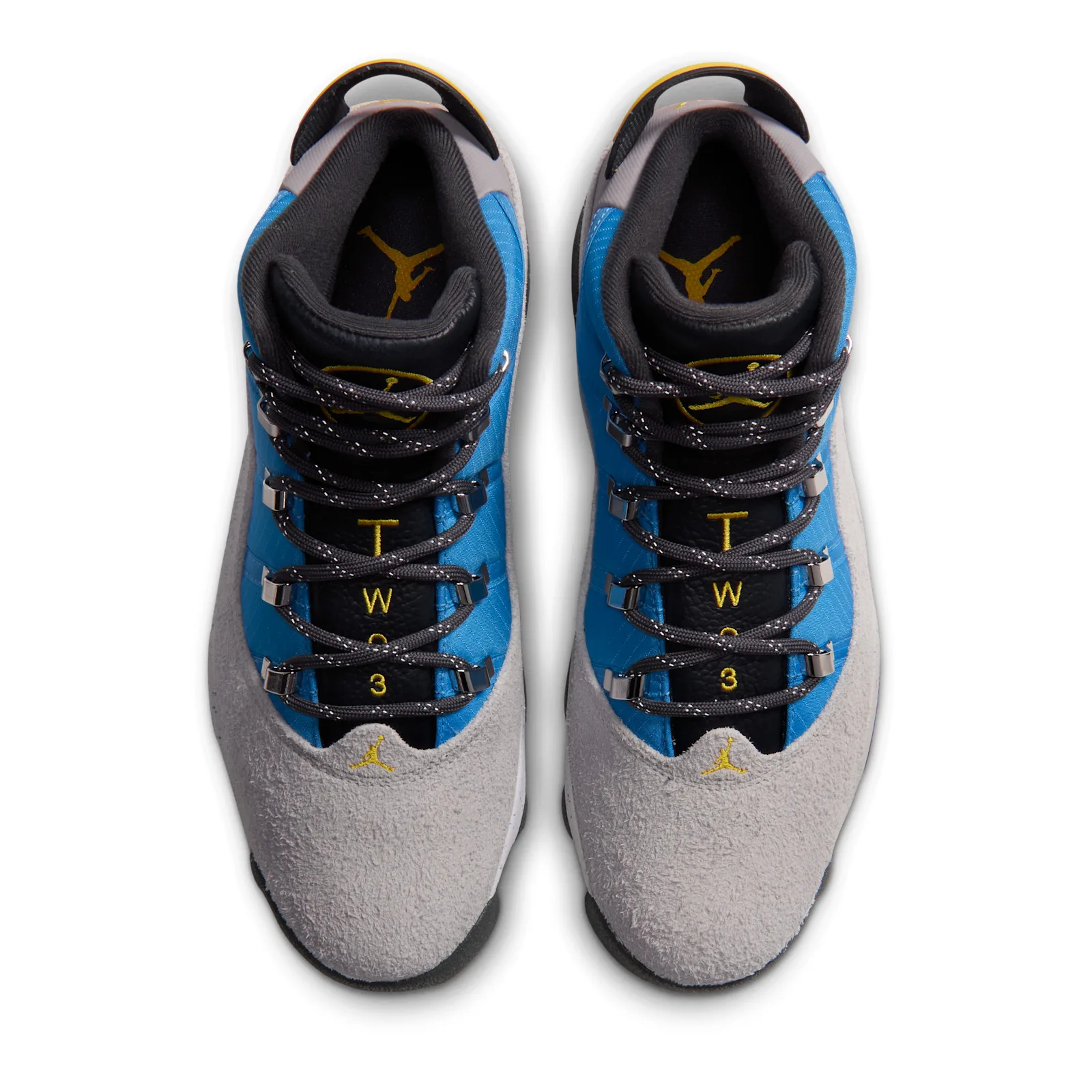 Top-down view of a pair with yellow Jumpman logos and T-W-3 lettering on black tongues, Cobalt Blue