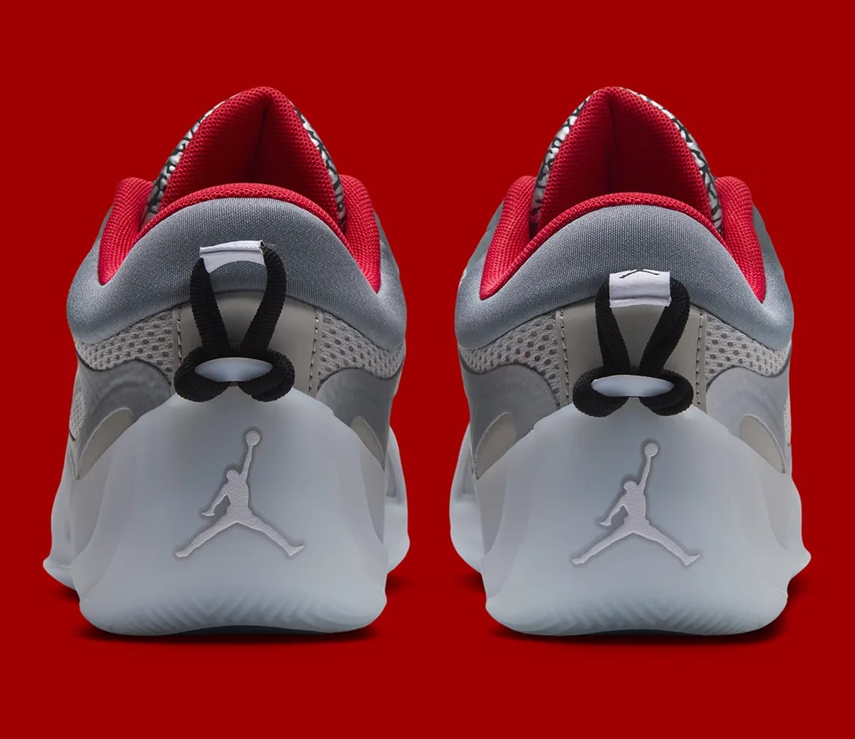 Heel pair with black pull loops and pale Jumpman logos on translucent soles, Elephant Print