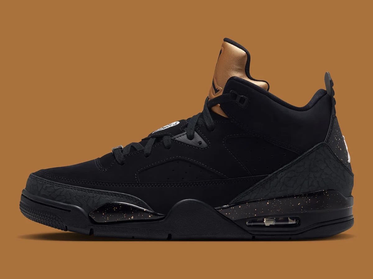 Lateral view of black nubuck sneaker with gold tongue and gold speckled midsole, Gold Tongue