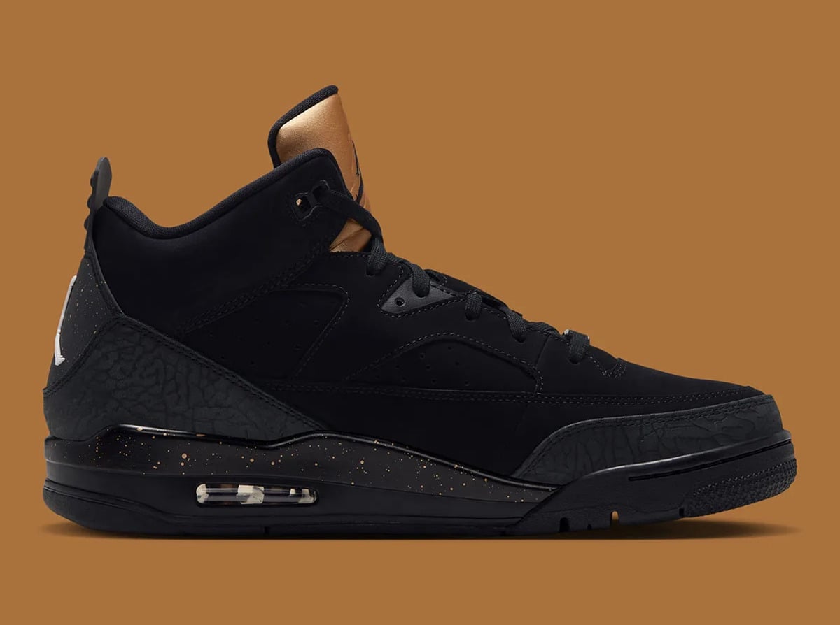 Medial view of black sneaker with gold-speckled midsole, visible air window and gold tongue, Gold Tongue