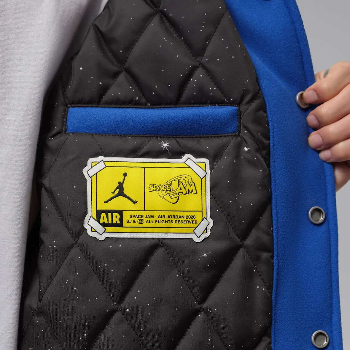Interior detail: quilted black starry lining with yellow Space Jam Air label, Varsity Royal/Black