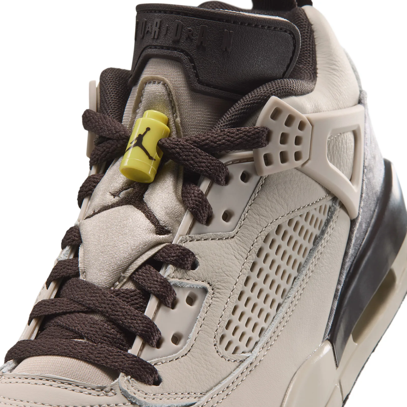 Detail of laces and tongue, yellow Jumpman lace toggle, perforated panel and Jordan tongue text, Realtree Camo