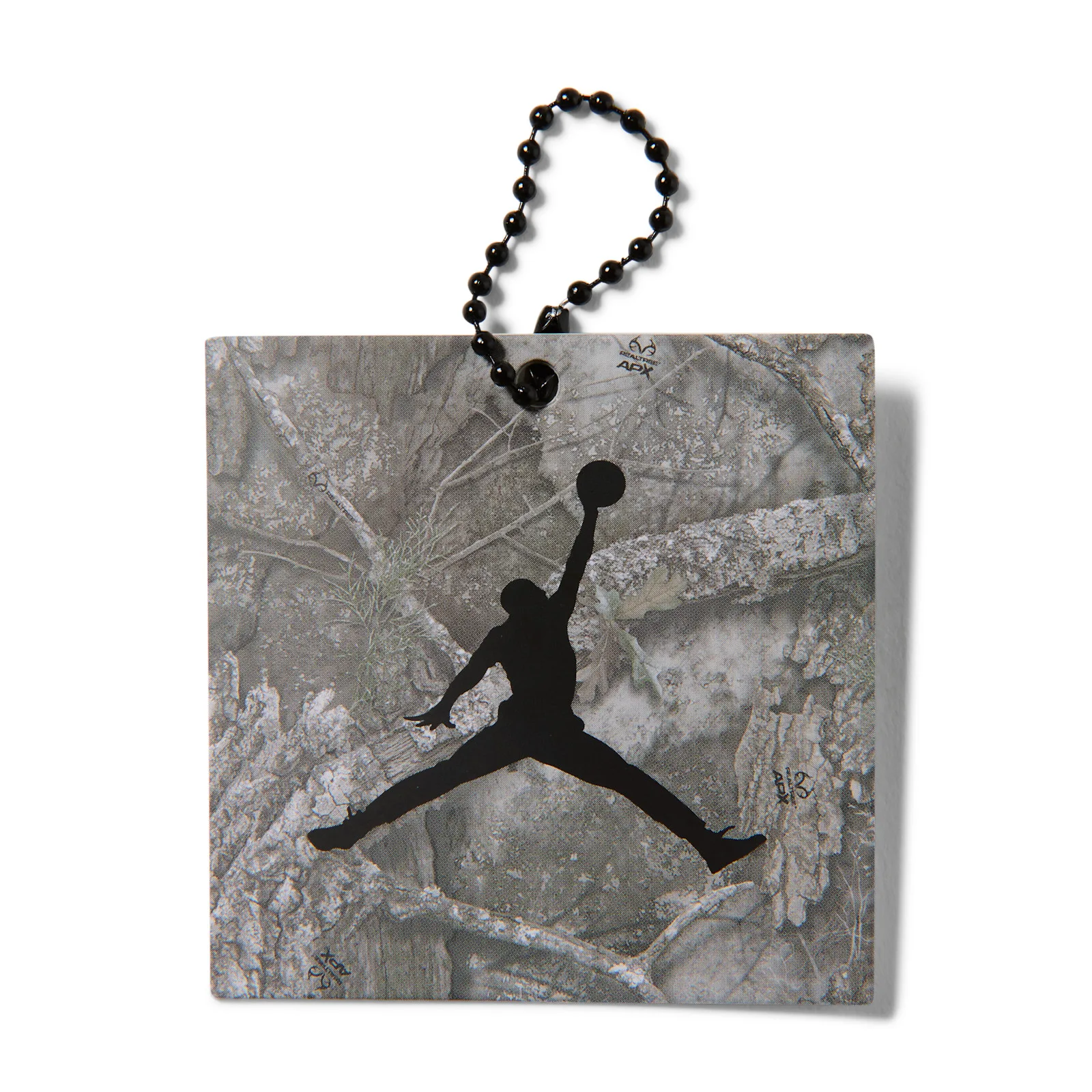 Hang tag on ball chain, grey tree-bark camo print with black Jumpman logo, Realtree Camo