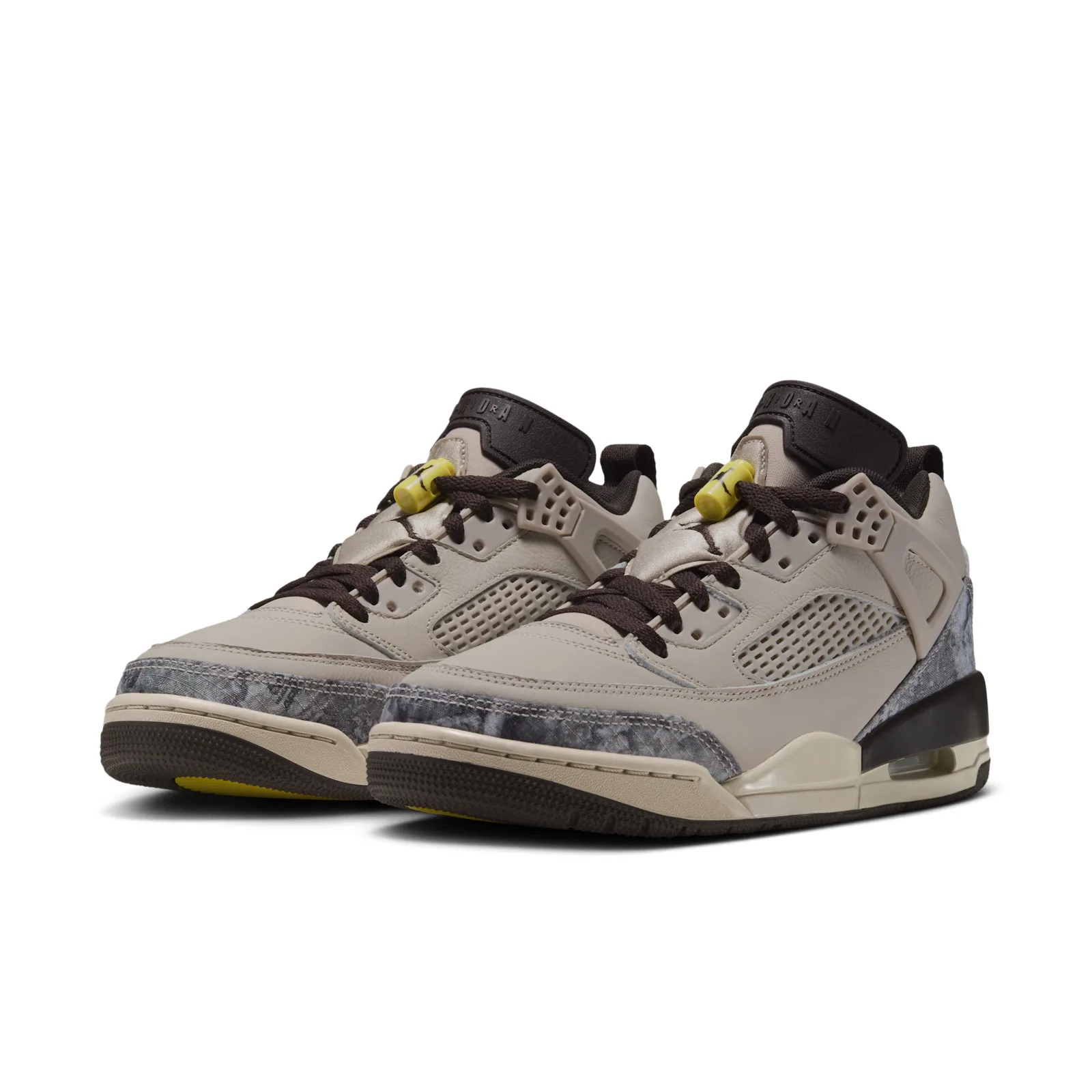 Pair at three-quarter angle, brown laces, yellow lace toggles and grey camo toe overlays, Realtree Camo