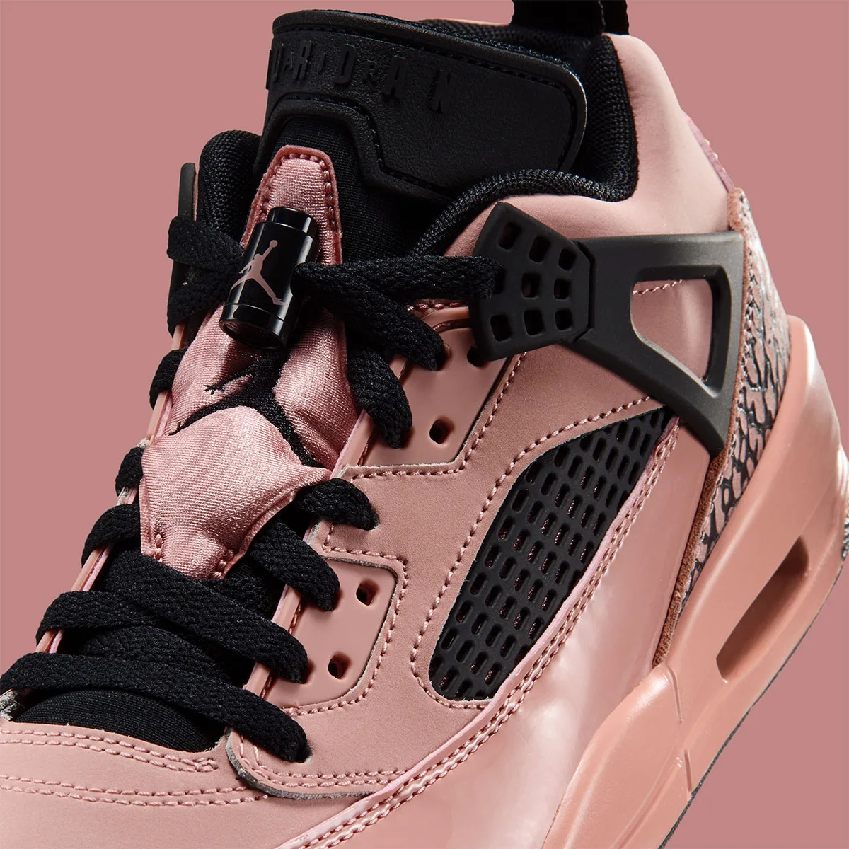 Upper detail with pink satin tongue, black Jumpman and black mesh, Rust Pink