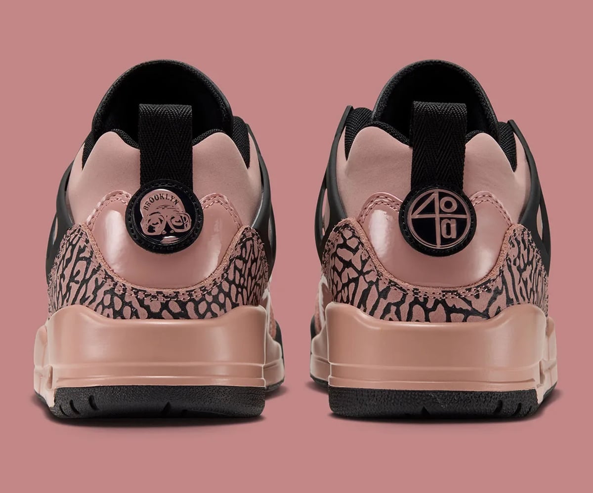 Heel view of pair with elephant-print panels and circular logo badges, Rust Pink