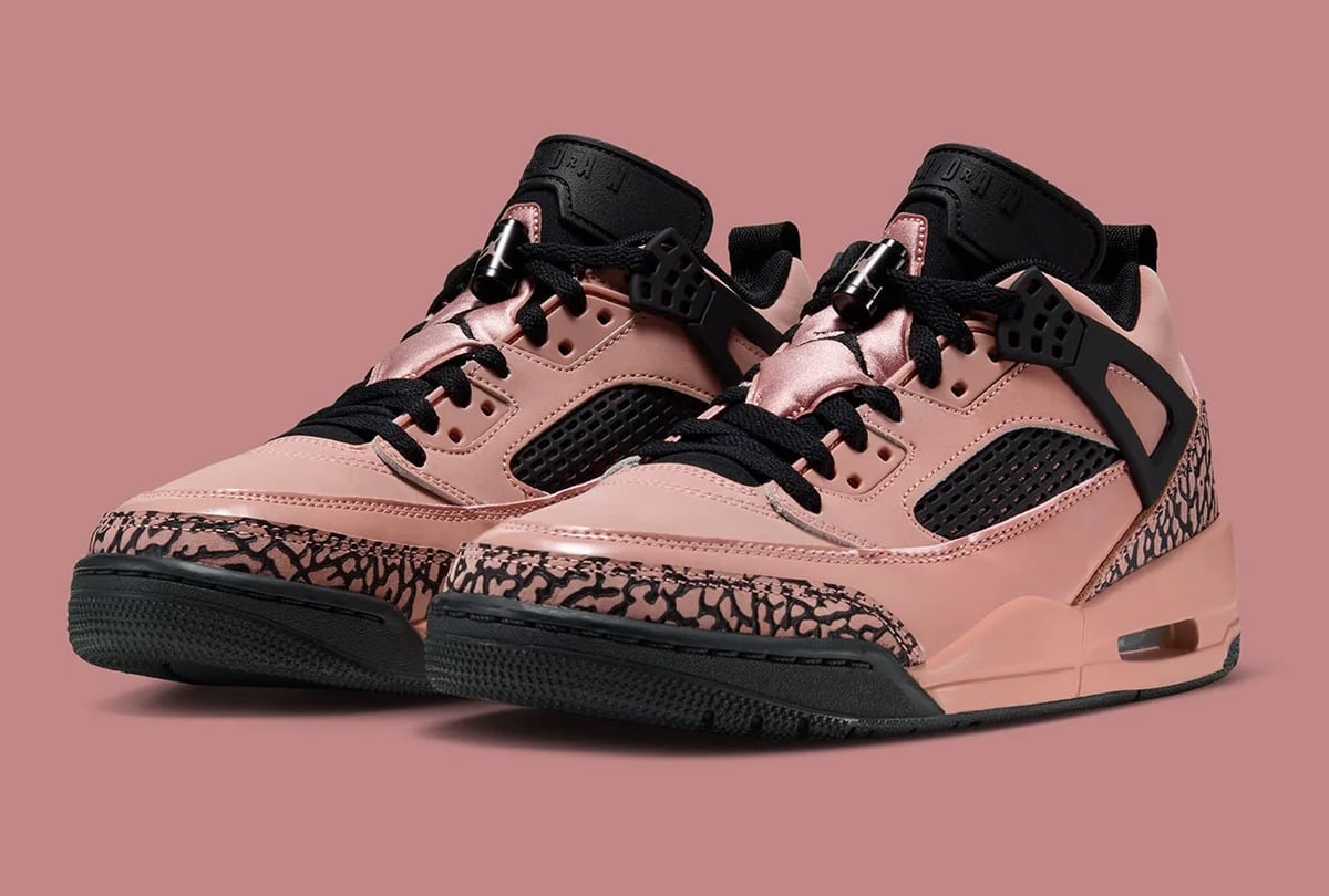 Pair in front three-quarter view with black laces and pink elephant-print trim, Rust Pink
