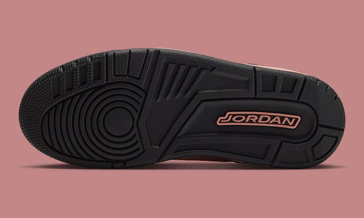 Black outsole with circular tread and pink Jordan lettering, Rust Pink