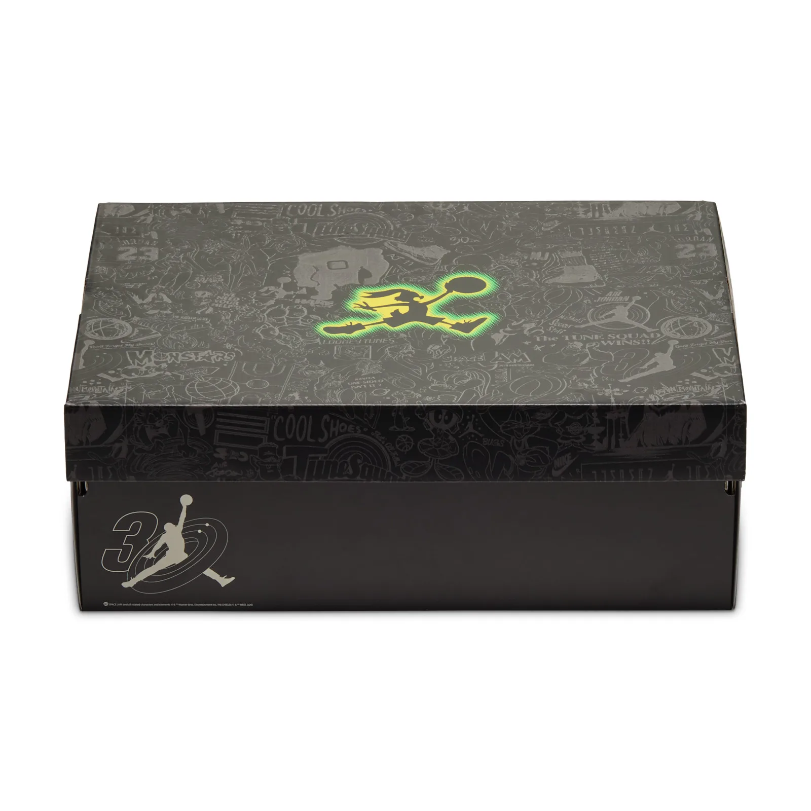 Black shoebox lid with grey cartoon character pattern and glowing green Jumpman figure, Space Jam