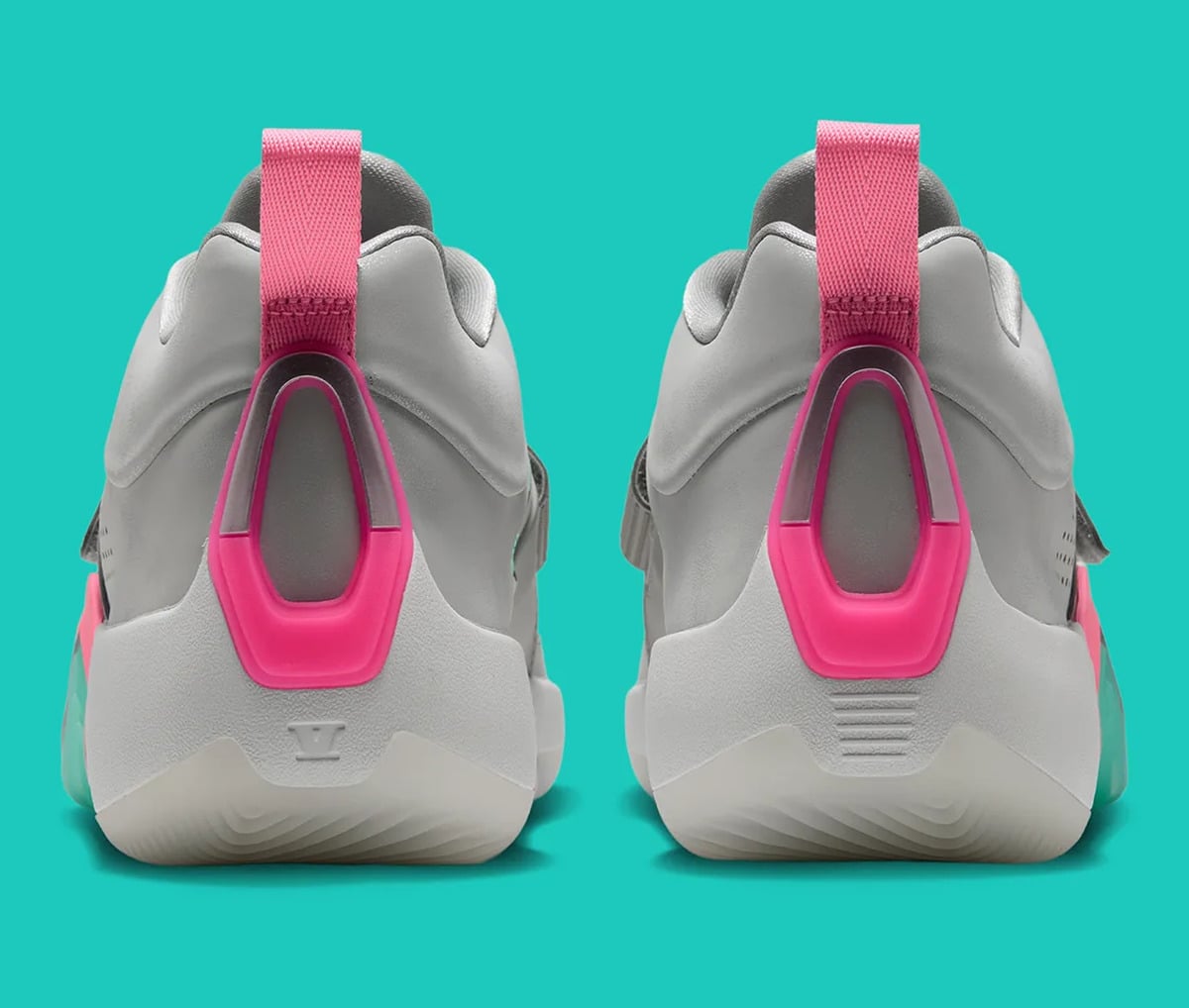 Heel view of pair, grey uppers with pink pull tabs and pink clear-window heel counters, South Beach
