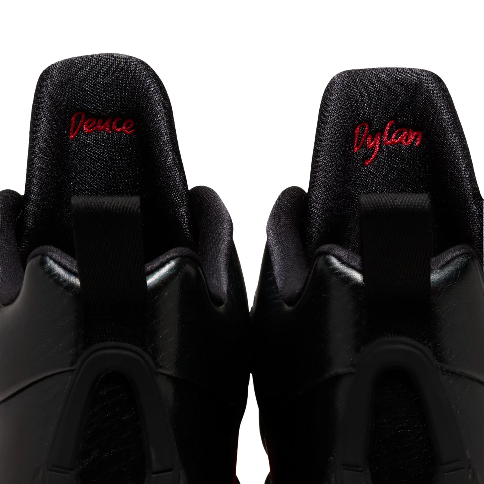 tongue detail of pair, Deuce and Dylan embroidered in red on black tongues, Sunset
