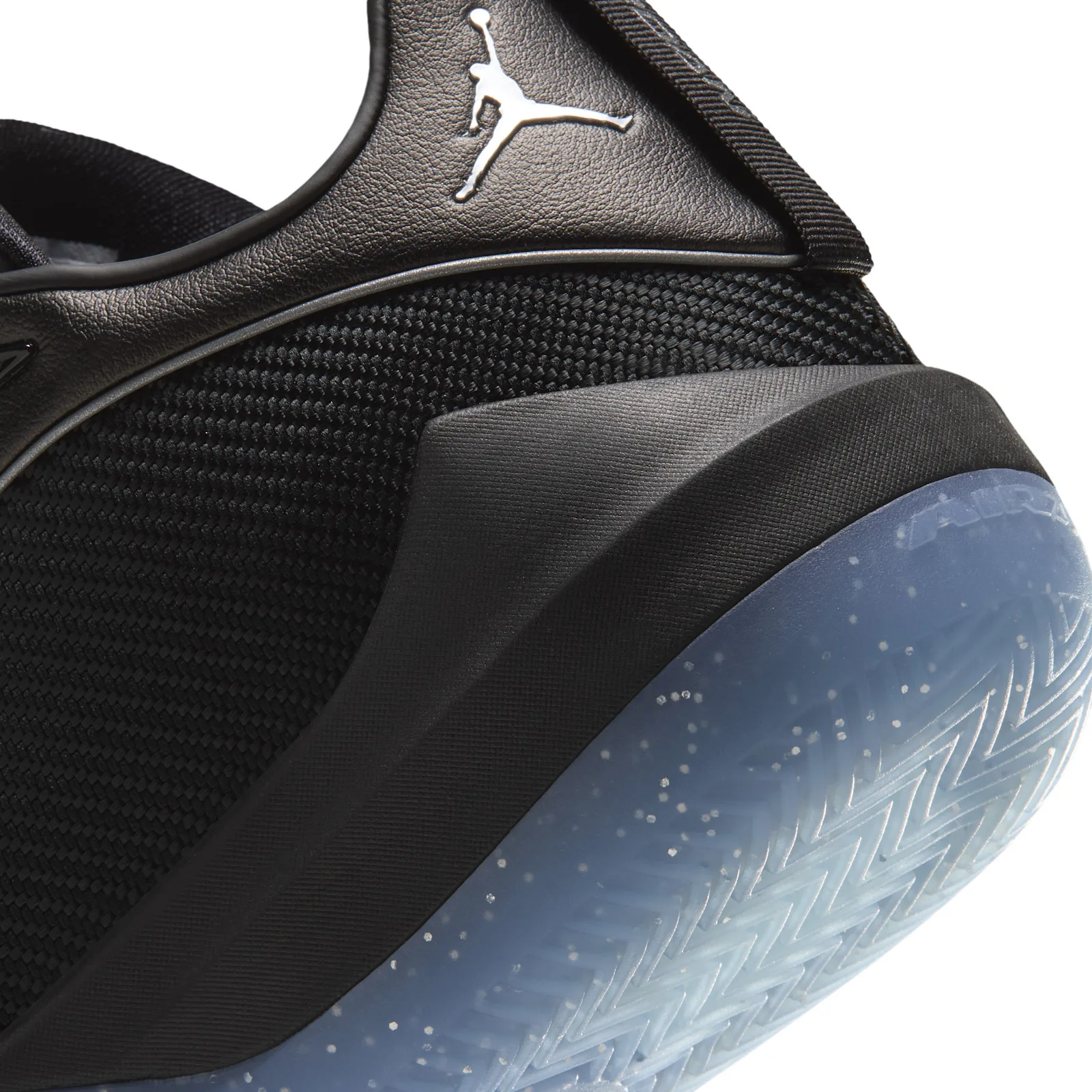 Detail of the heel, silver Jumpman on black leather, woven mesh, speckled blue sole with AIR text, Black/Metallic Silver