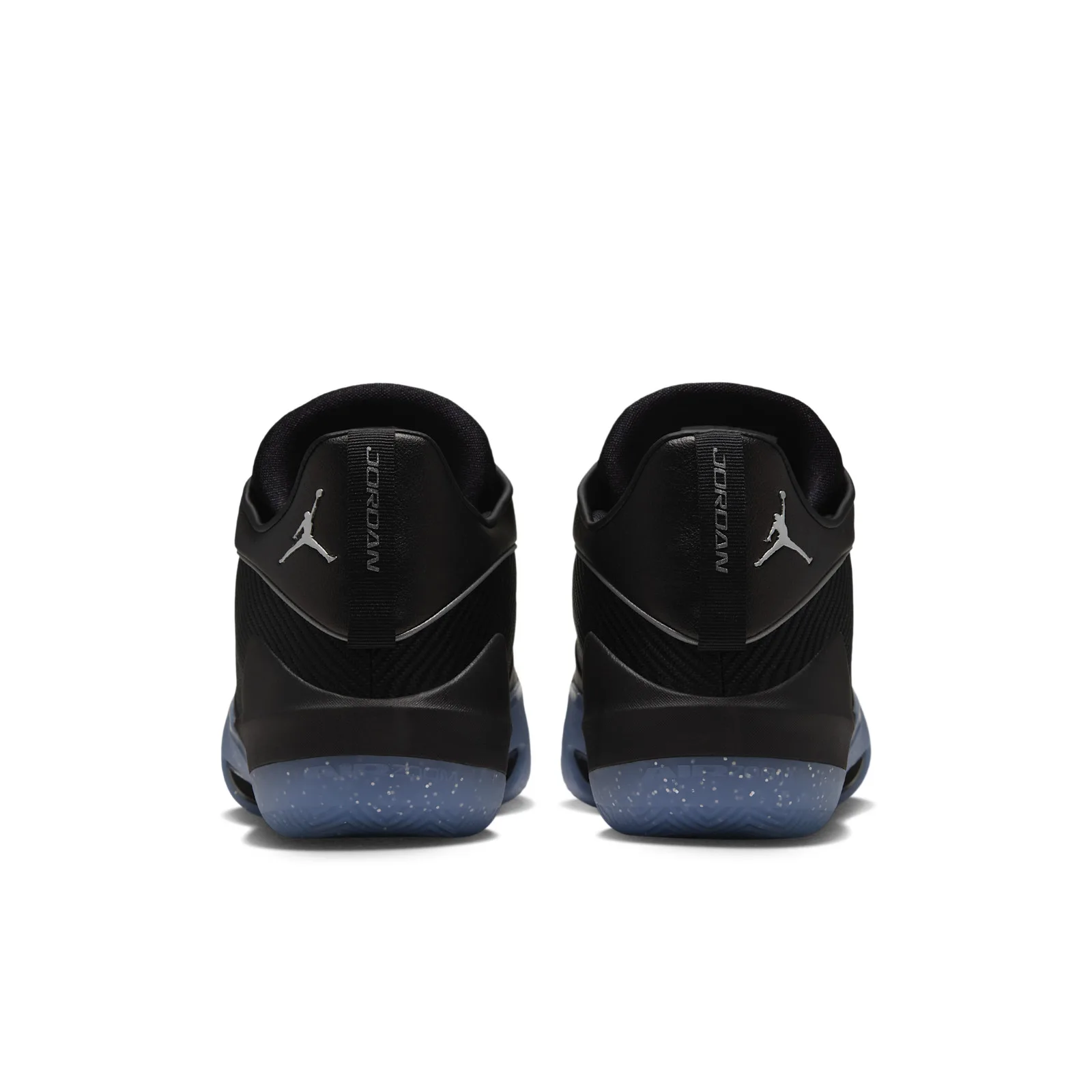 Heel view of the pair, silver Jumpman logos, vertical JORDAN text on heel tabs, speckled blue soles, Black/Metallic Silver