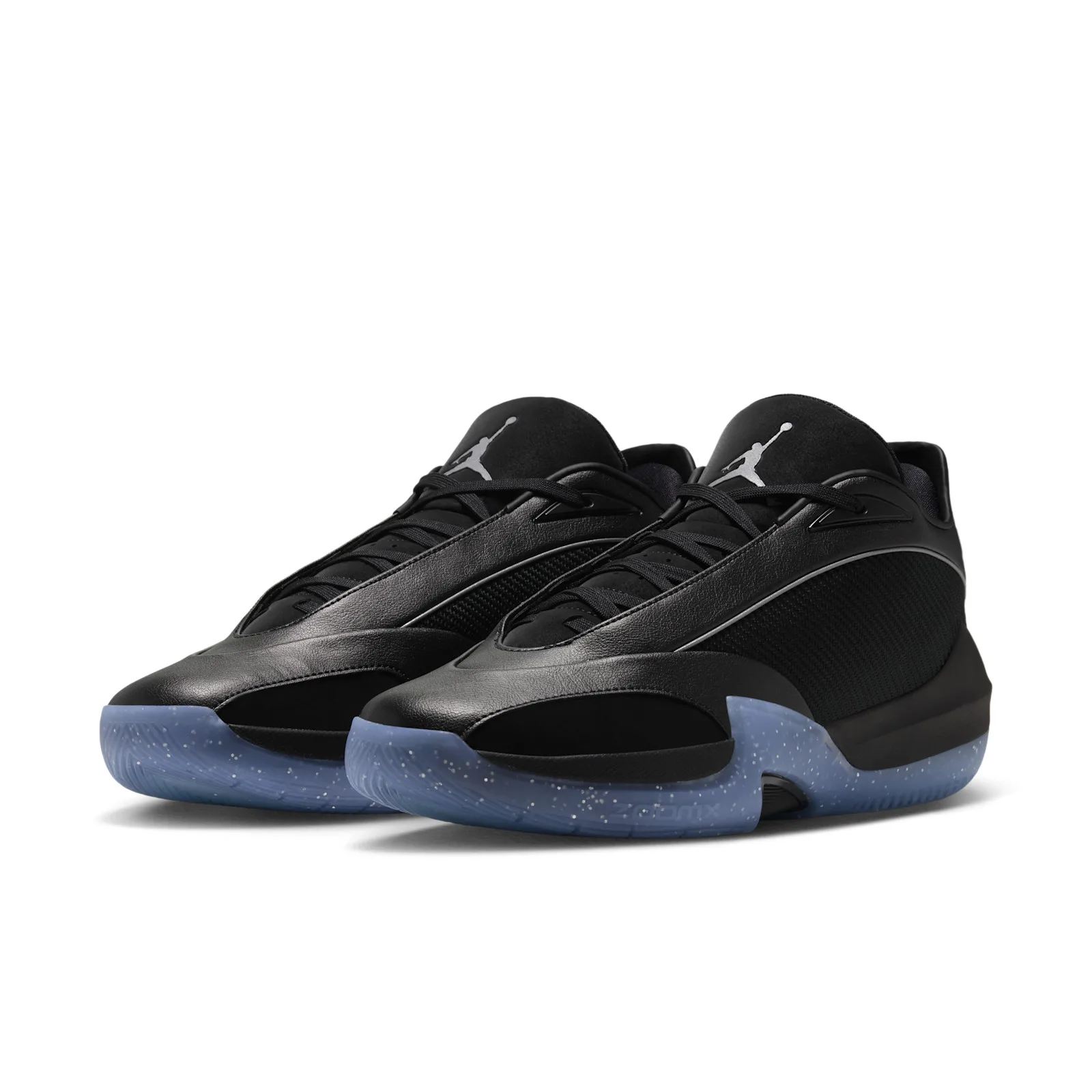Pair at three-quarter angle, black leather and mesh uppers, silver Jumpman on tongues, icy blue soles, Black/Metallic Silver