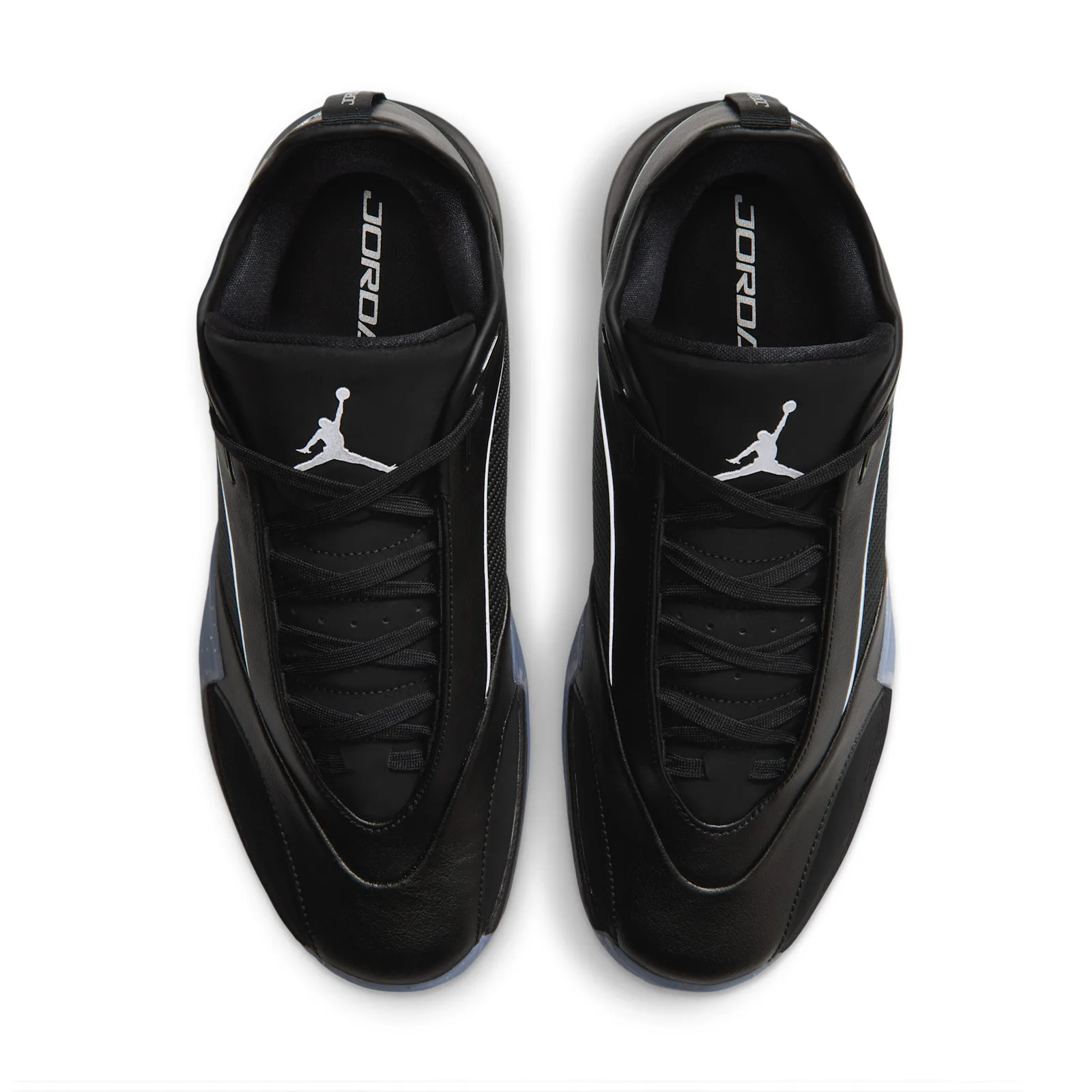 Top-down view of the pair, crisscross black laces, white Jumpman on tongues, JORDAN insole text, Black/Metallic Silver