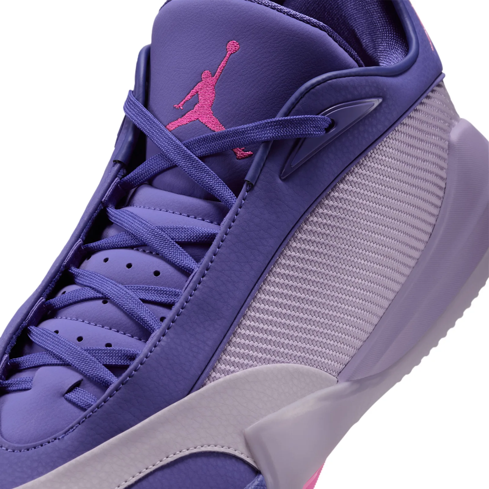 Close-up of laces and tongue with pink Jumpman, purple textured leather and woven lilac side panel, Bright Concord