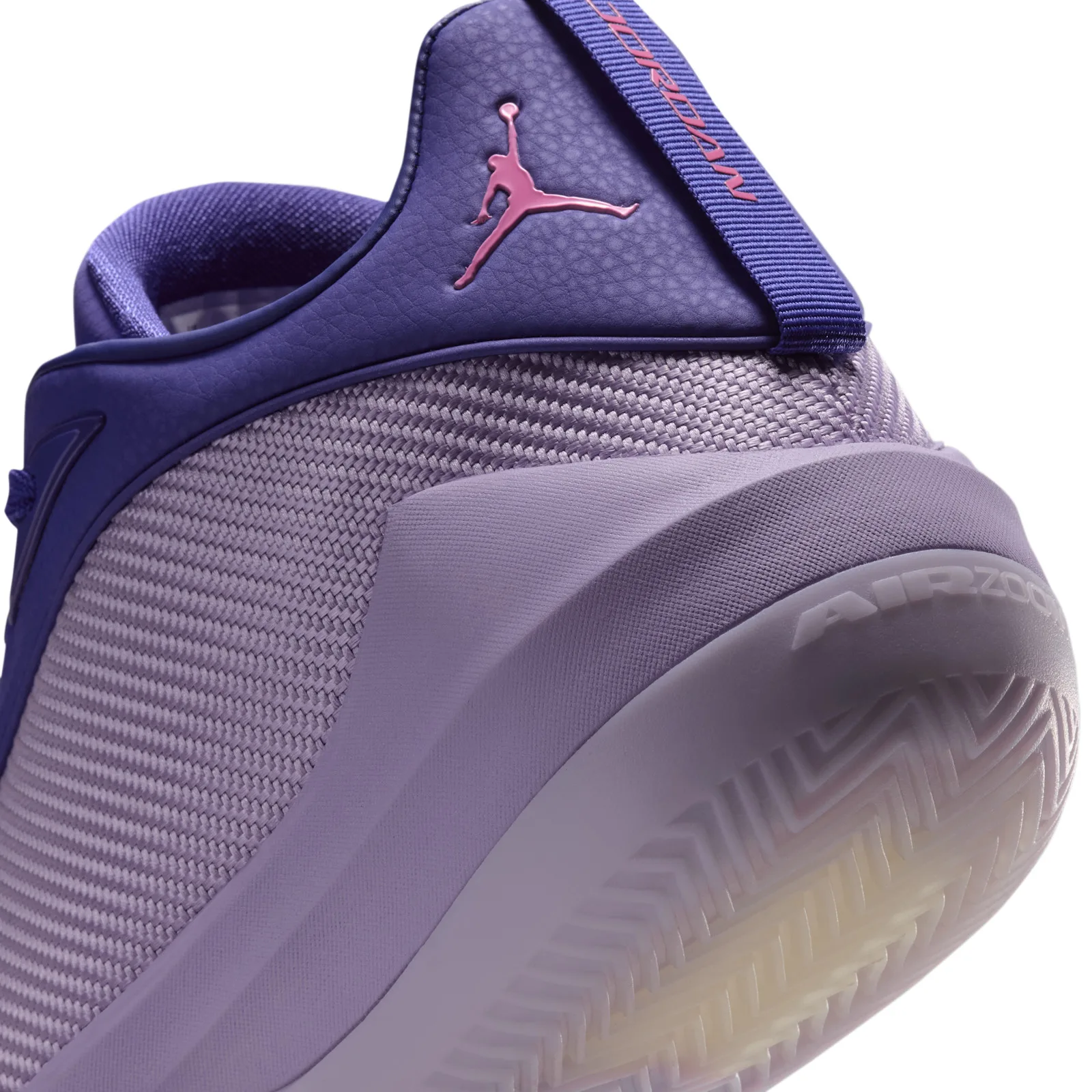 Close-up of the heel with pink Jumpman on purple textured tab, woven lilac panel and AIR ZOOM text on the midsole, Bright
