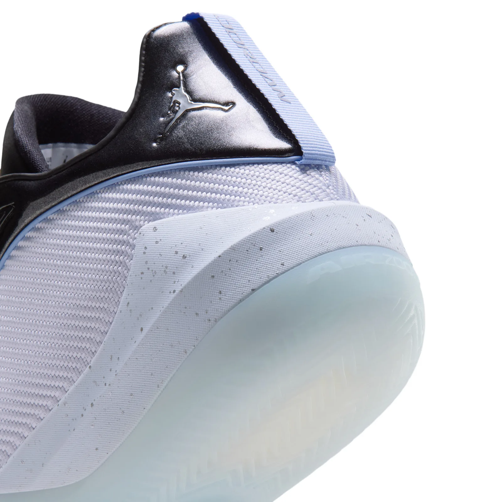 Detail of heel, silver Jumpman on black patent, light blue pull tab, speckled midsole, Space Jam