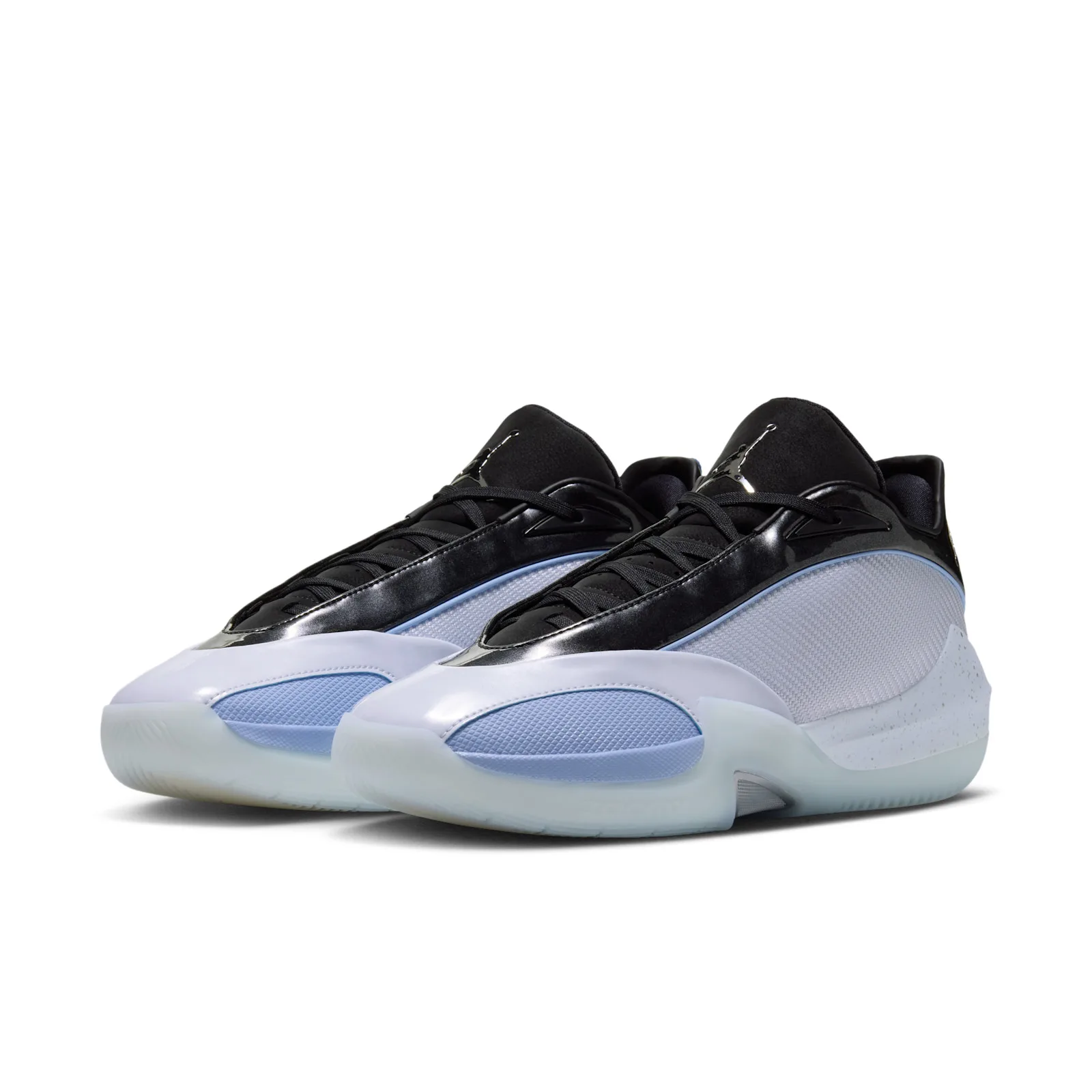Pair at three-quarter angle, black patent overlays, light blue toe caps, icy translucent soles, Space Jam