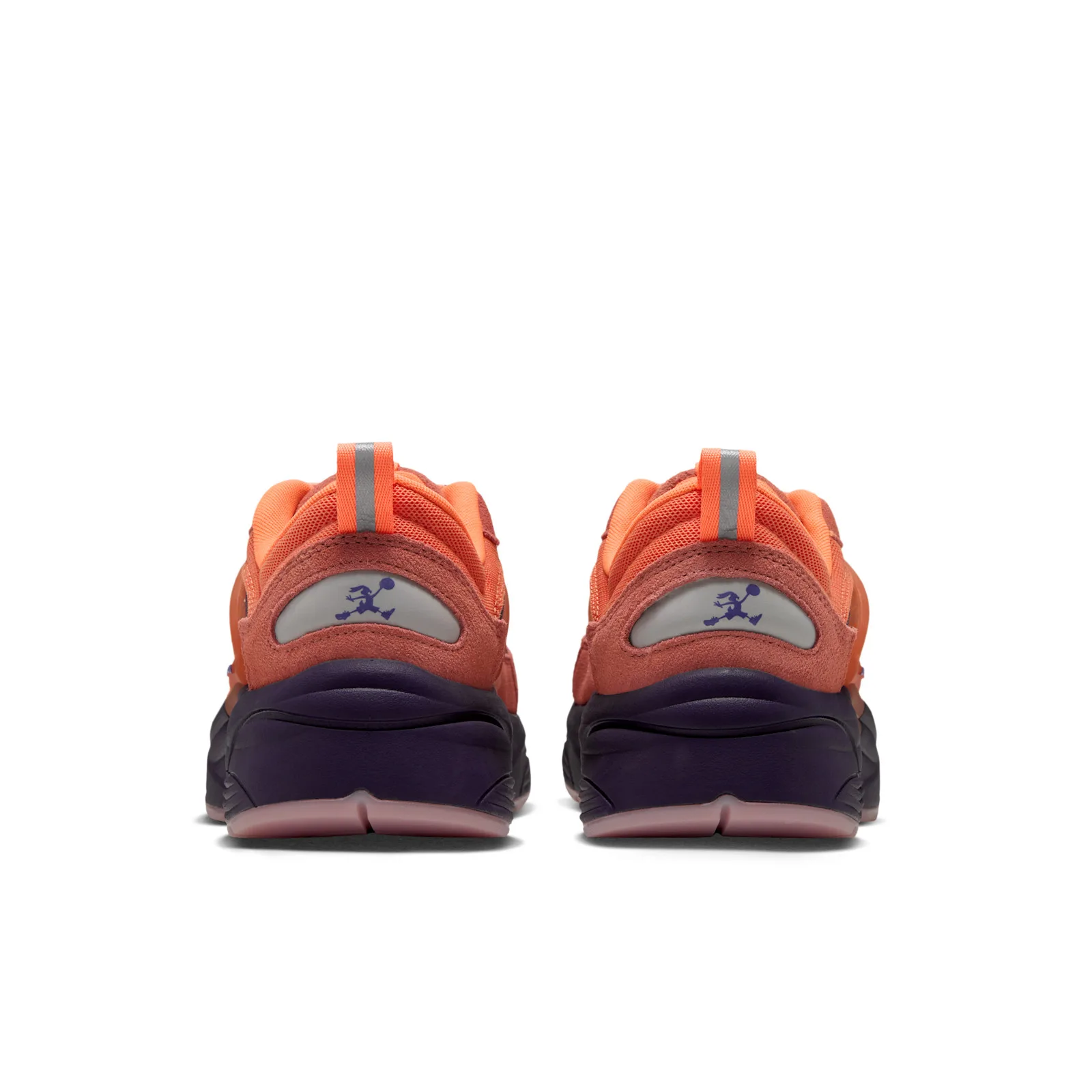 Heel view of pair, purple Jumpman-style cartoon rabbit logos on grey heel patches, orange pull tabs, purple soles, Space Jam