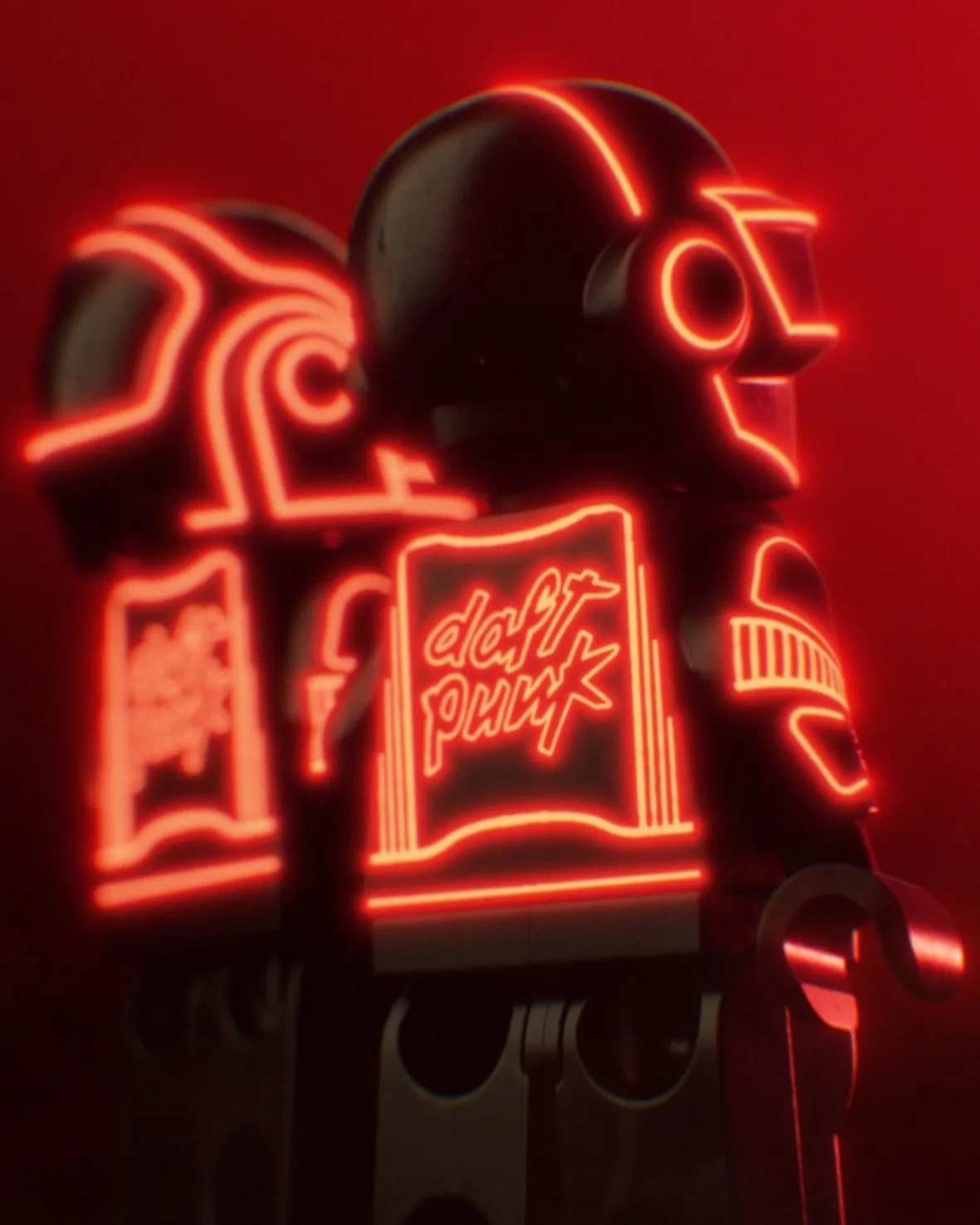 Close detail of back of a minifigure with glowing red daft punk logo on its jacket, 2007 Stage Set