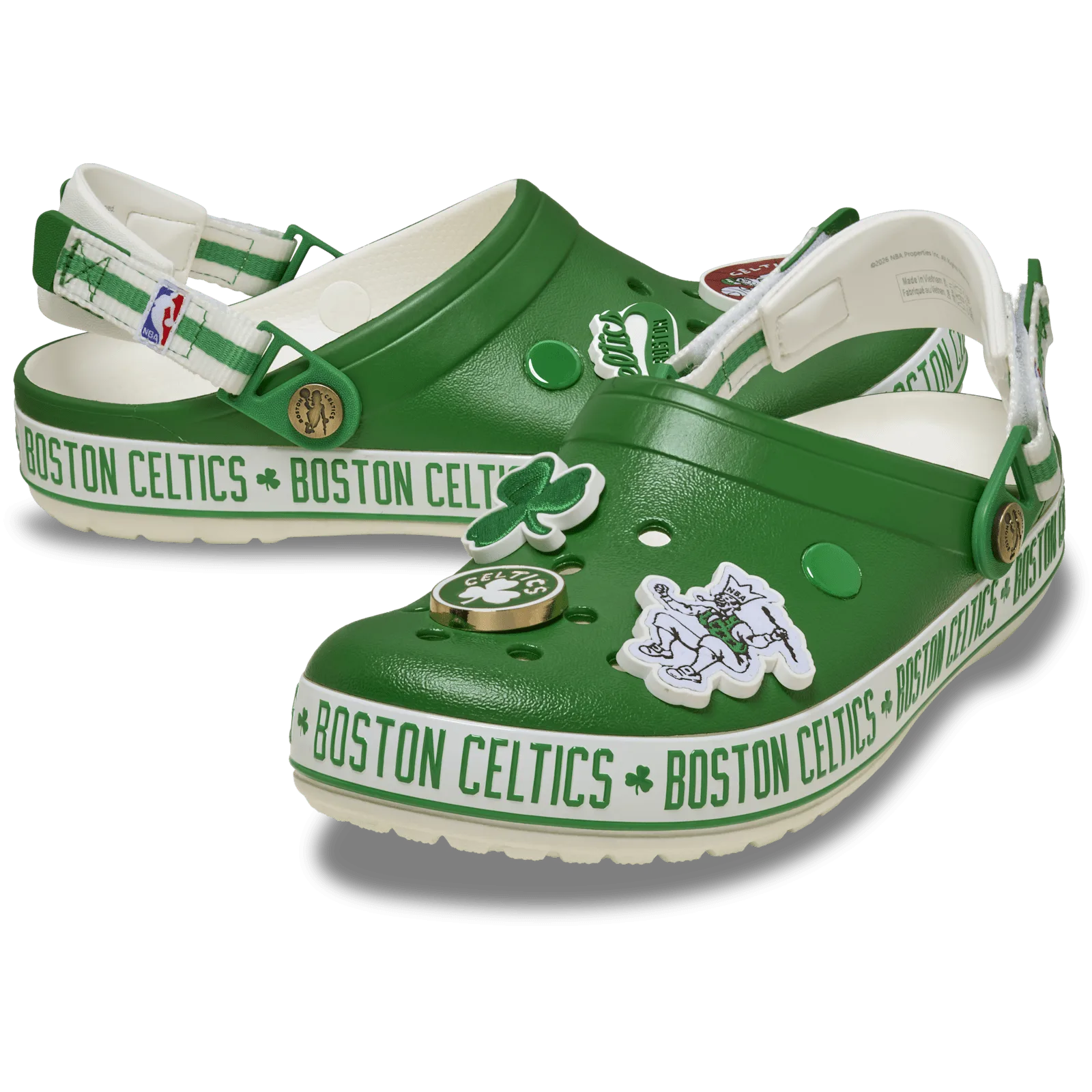Pair of green clogs with white Boston Celtics bands, shamrock and logo charms, Crocband Clog Collection