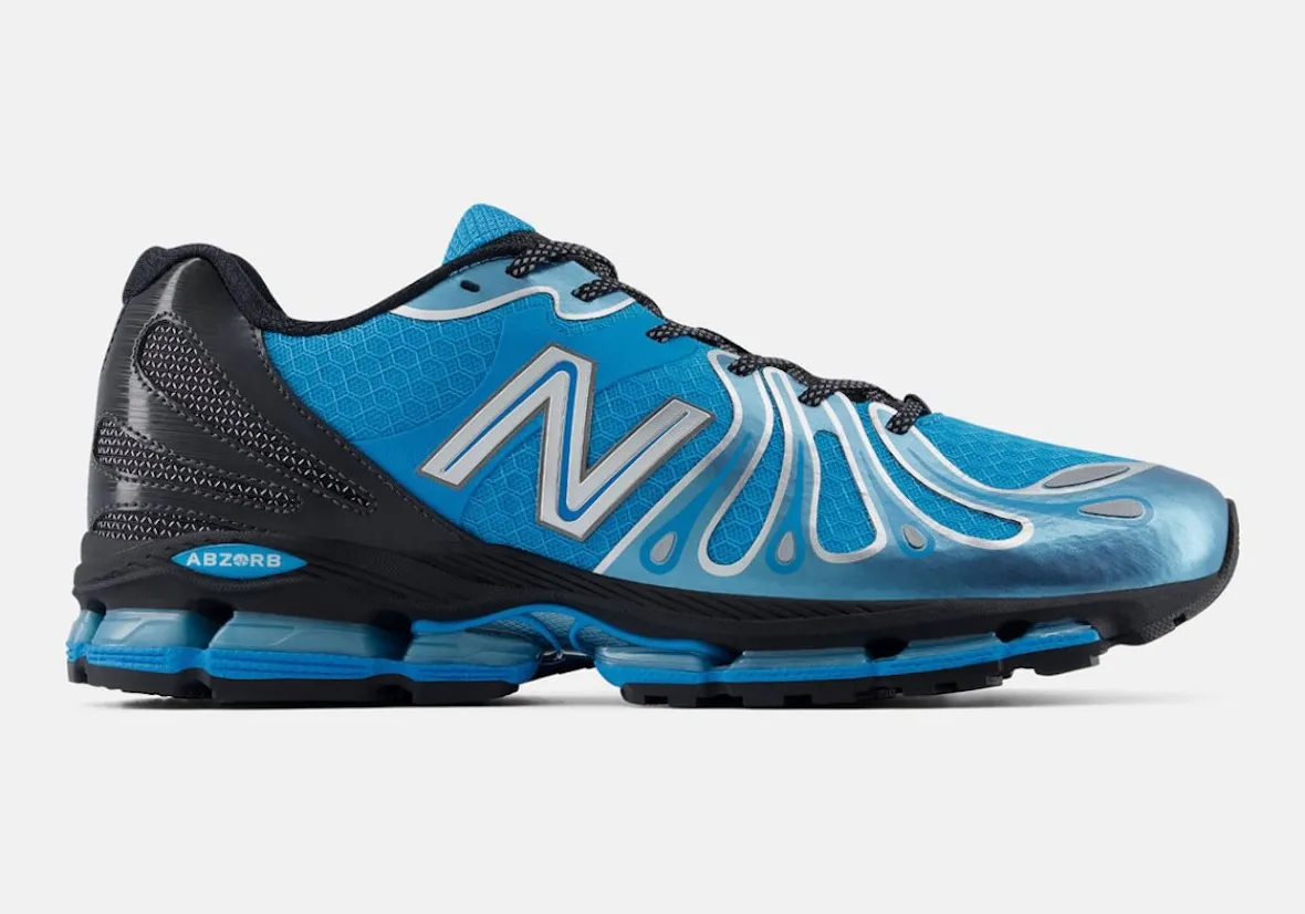 lateral view, blue mesh upper with silver N logo and black heel overlay, Blue/Silver/Black