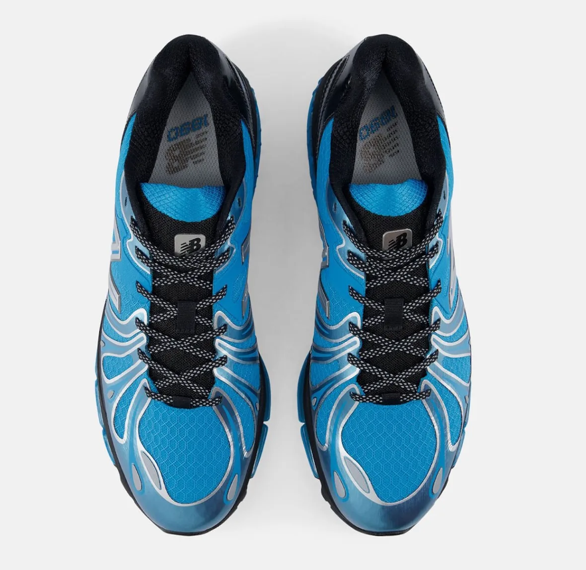 top-down view of pair, blue tongues and laces with silver N logos, Blue/Silver/Black