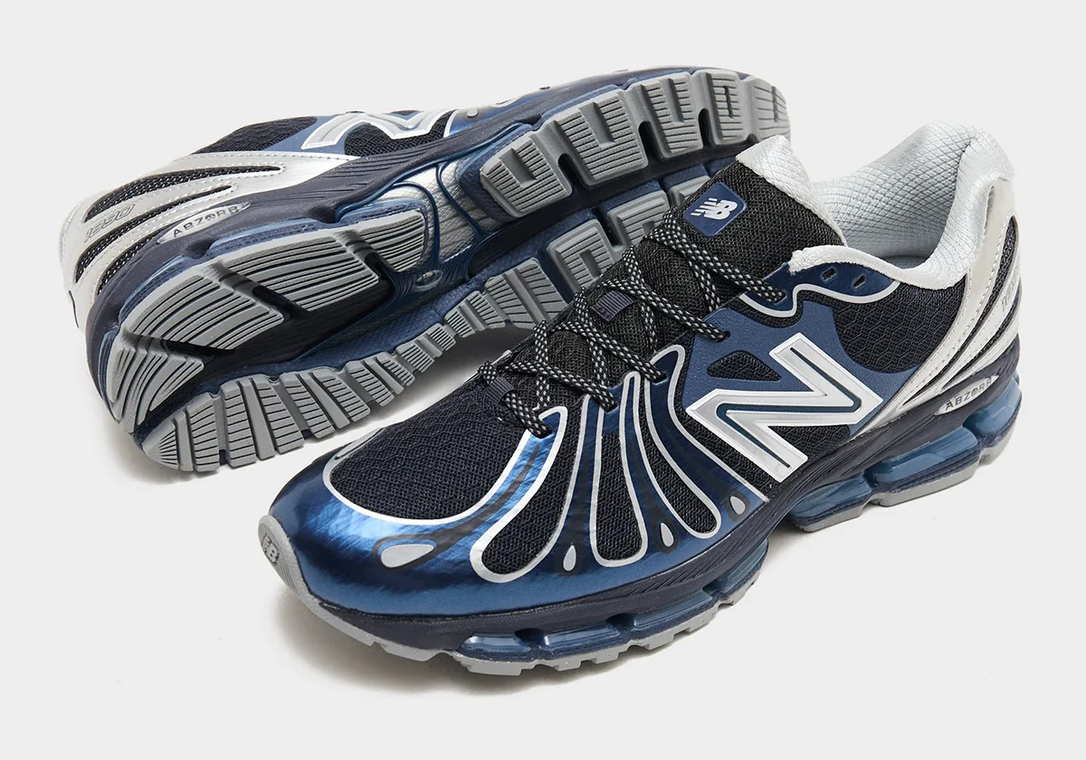 Pair with one shoe on its side showing grey outsole lugs, other upright with blue toe and silver N, Metallic Blue