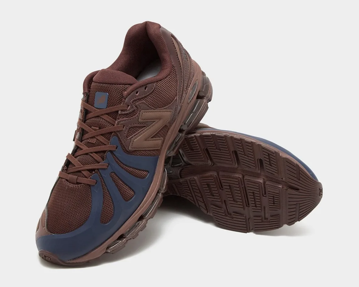 Brown and navy sneaker with the other shoe angled up to show the brown tread outsole, Brown/Navy
