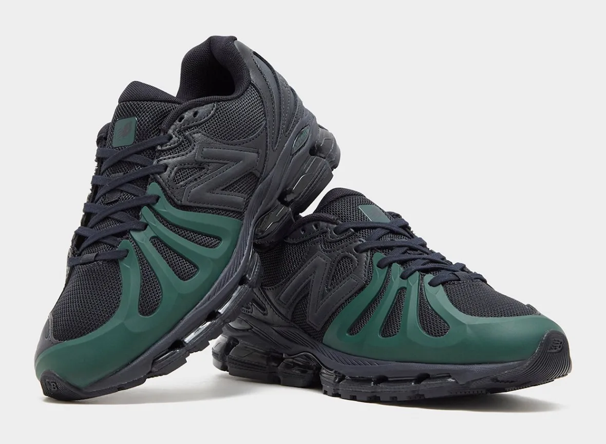 Pair of black sneakers with green toe overlays, one resting on the other, laced up, N logo on side, Brown/Navy
