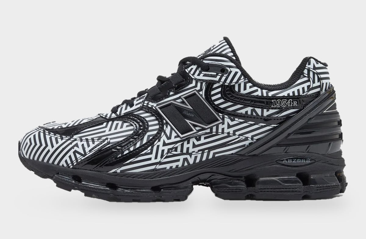 Lateral view with black N logo, 1954R text on the collar and black chunky sole, Dazzle Camo