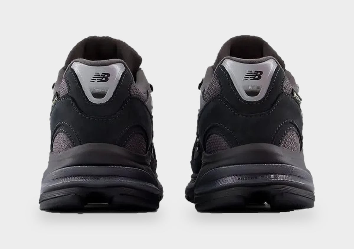 Heel view of pair, silver-grey pull tabs with NB logo and chunky black midsole, Black/Field Green