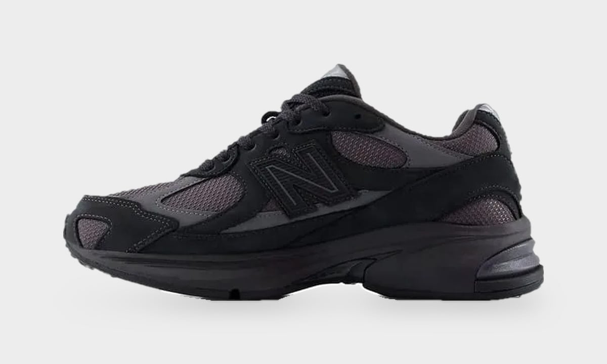Medial view of black sneaker with charcoal mesh panels and tonal N logo, toe left, Black/Field Green